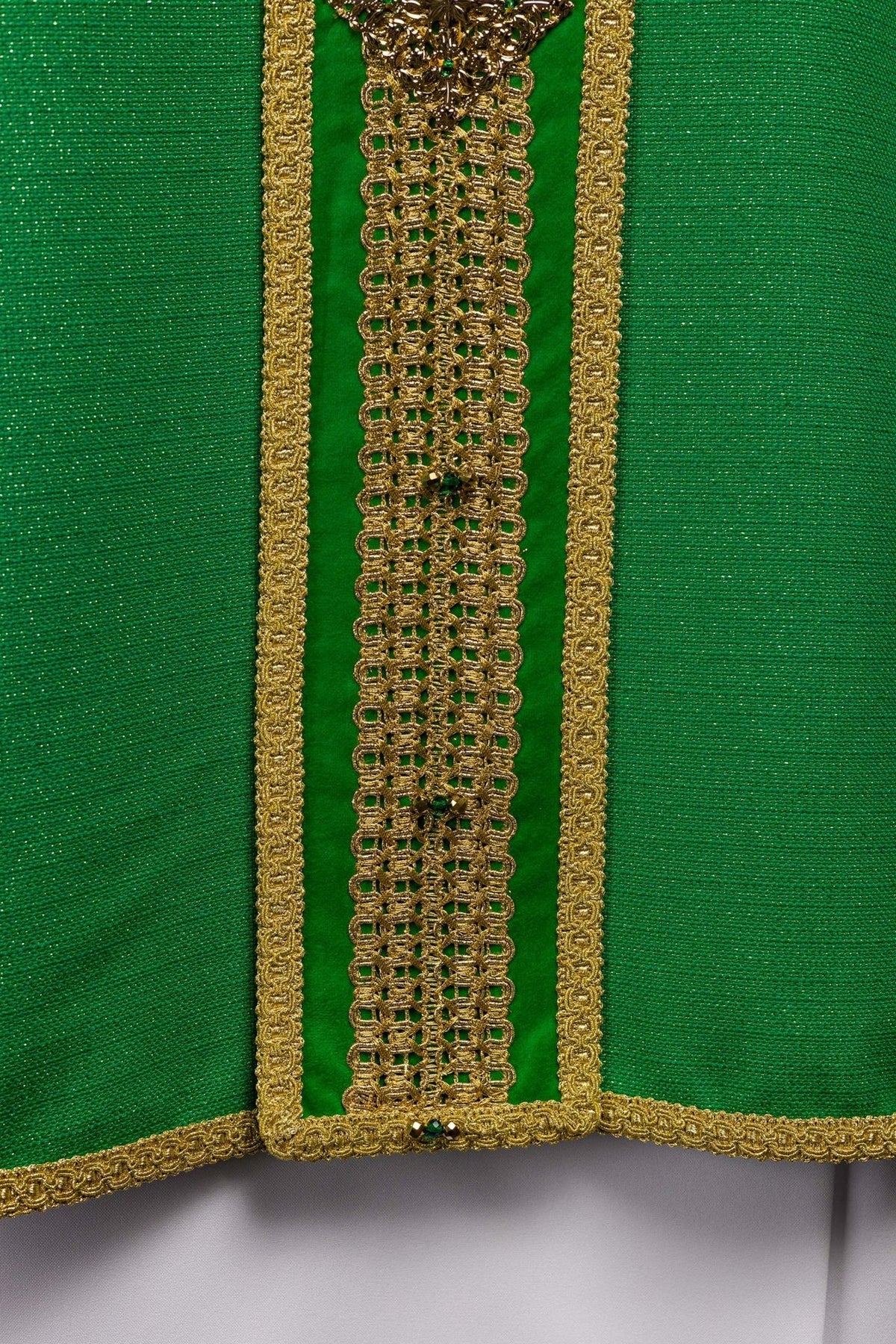 Green chasuble orphrey detail showing gold trim and natural stones