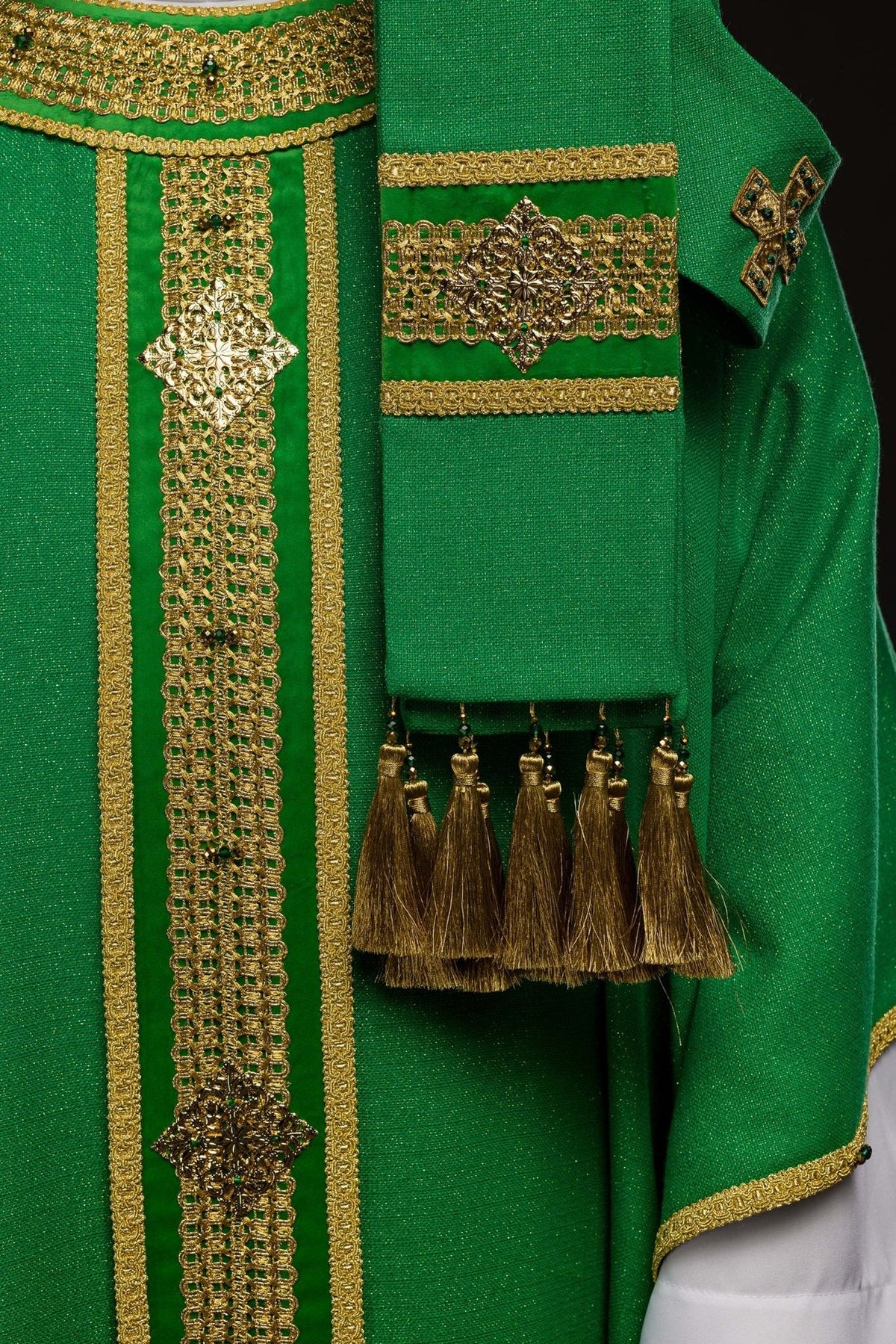 Green chasuble front and sleeve detail with gold embroidery and tassels