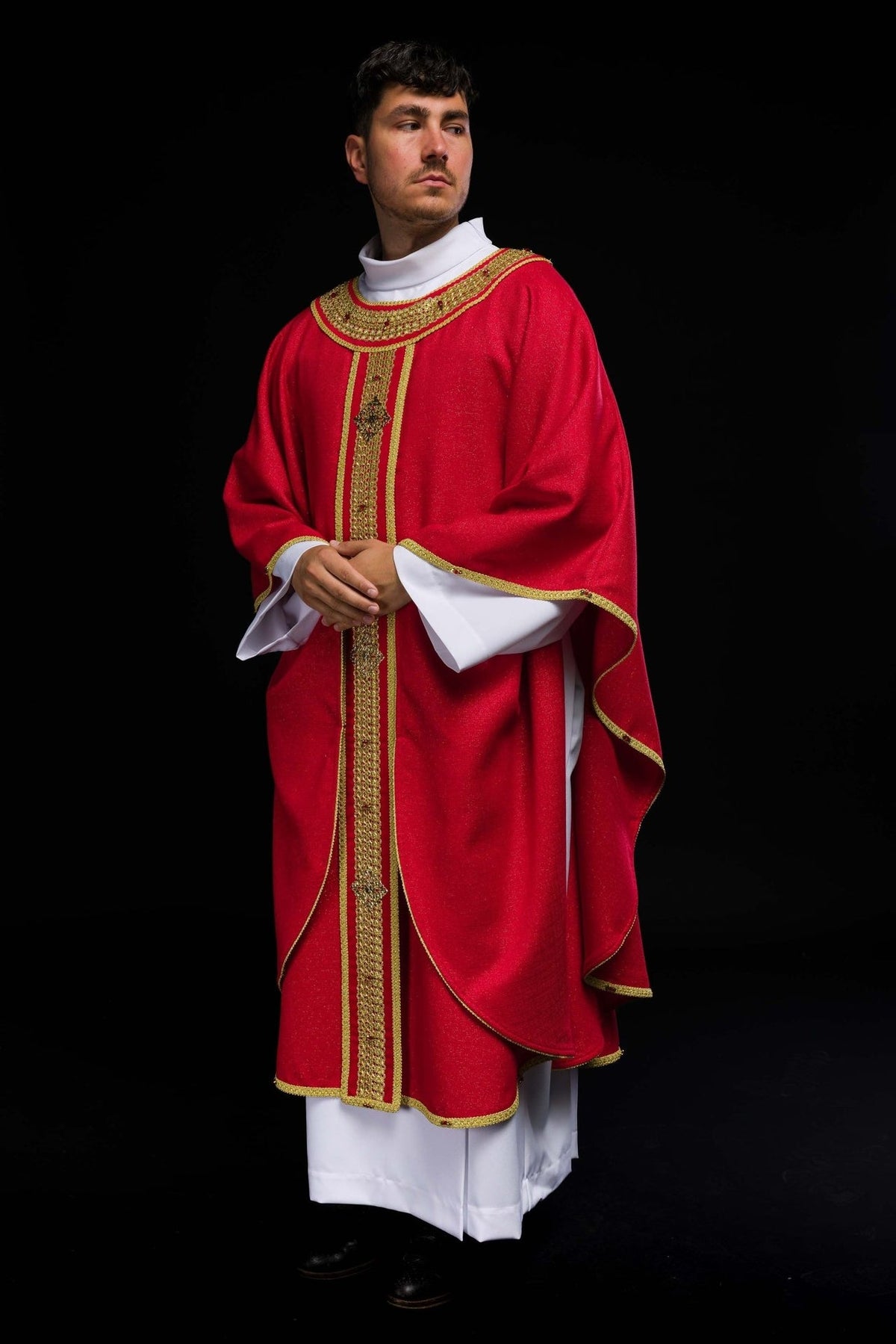 Handcrafted chasuble worn, front view with red fabric, gold embroidery and natural stones