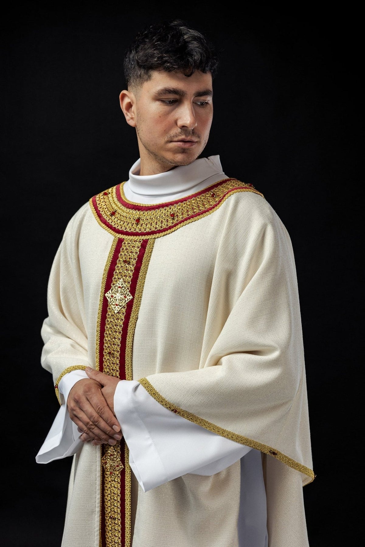 Handcrafted chasuble and stole worn from the front, ivory with red and gold orphrey