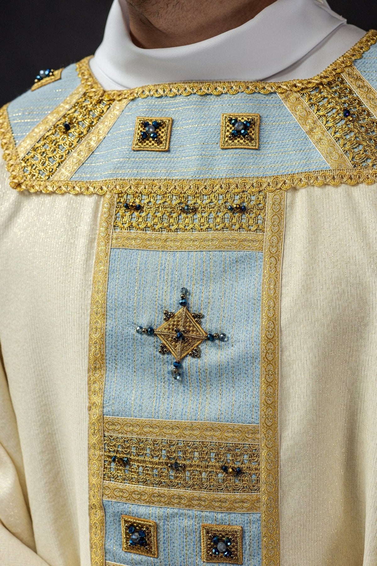 Marian chasuble, upper front close-up with blue shoulder panel and gold stone embroidery