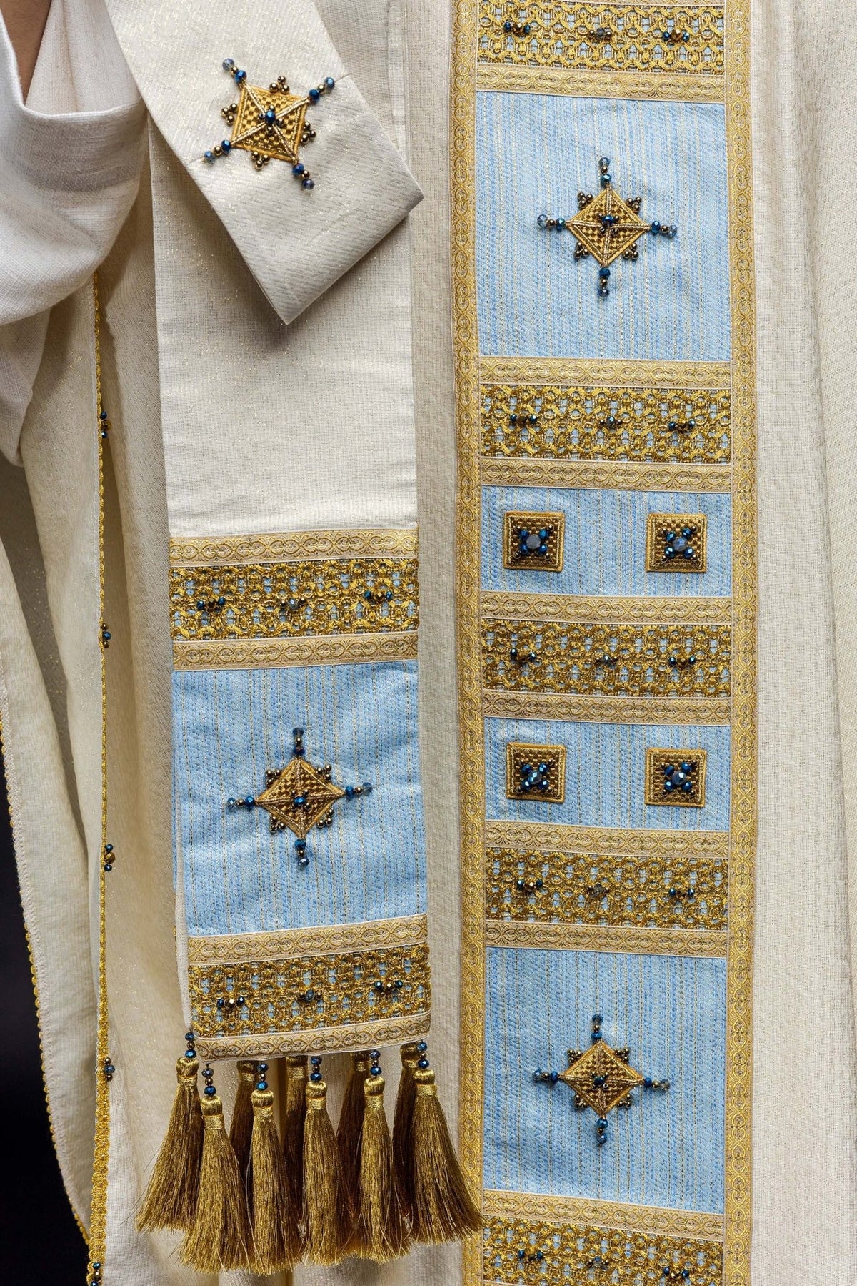 Marian chasuble, side detail showing gold tassel, blue orphrey and stone embroidery