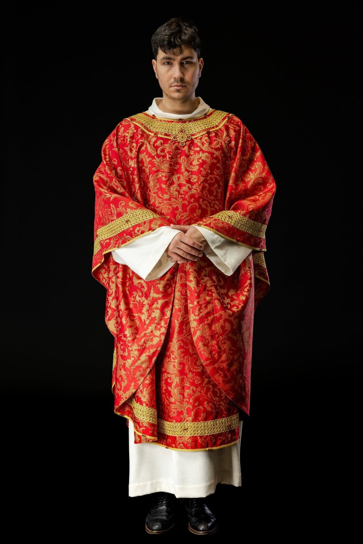 Red chasuble front view with gold embroidery, cross and wide sleeves