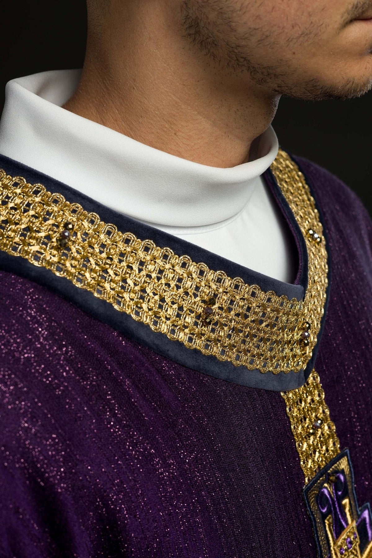 Purple chasuble close-up of cross embroidery and gold trim
