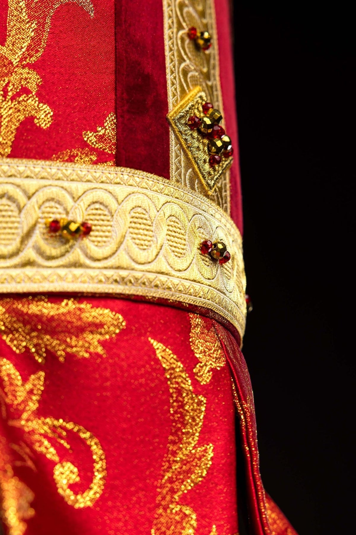 Red and gold miter rear-side view with matching panels and tassels