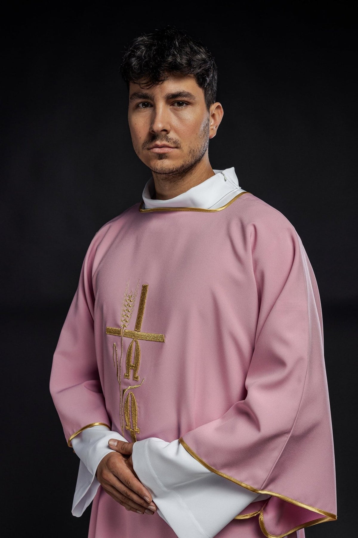 Rose dalmatic side view with gold trim and wide sleeves