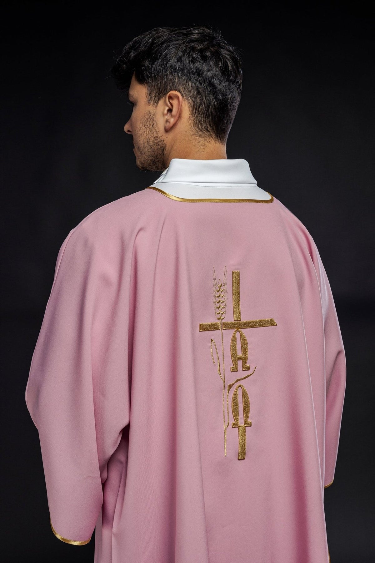 Rose dalmatic back view with gold Alpha and Omega embroidery