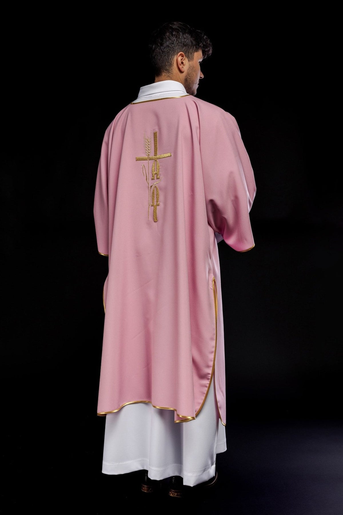 Rose dalmatic back view showing central gold embroidery and trim