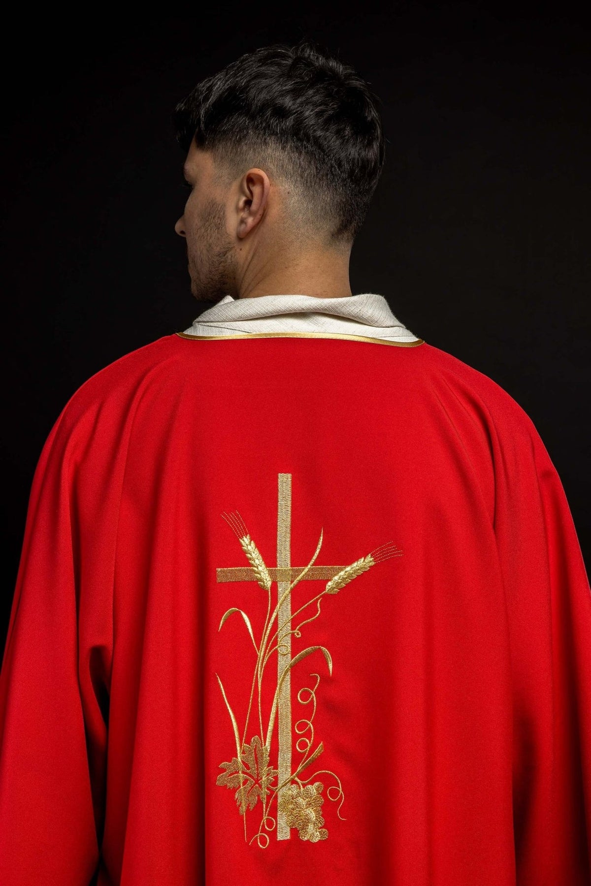 Red dalmatic back view with gold cross, wheat, grape and vine embroidery