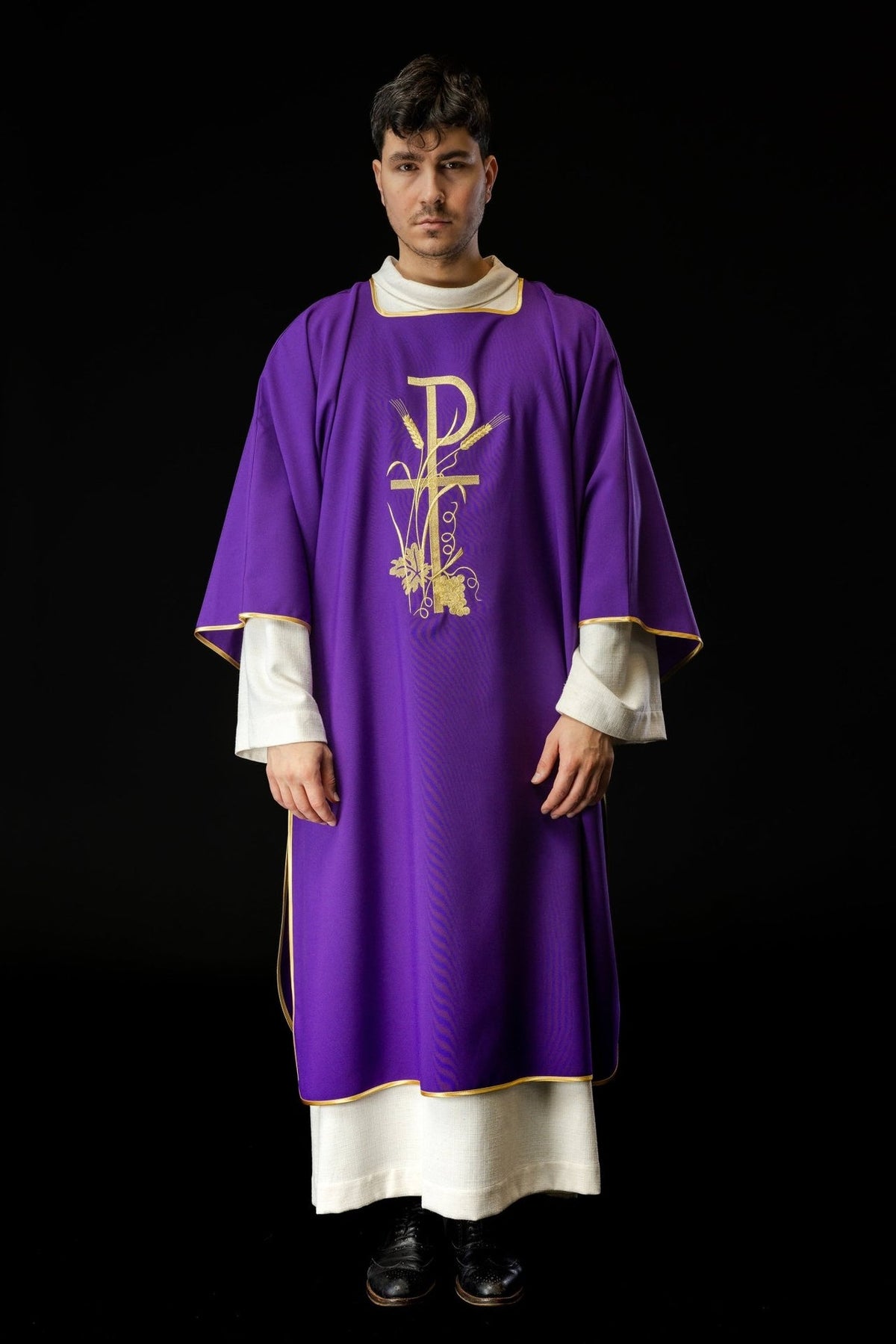 Purple dalmatic shown full length from the front with gold trim and PAX cross embroidery