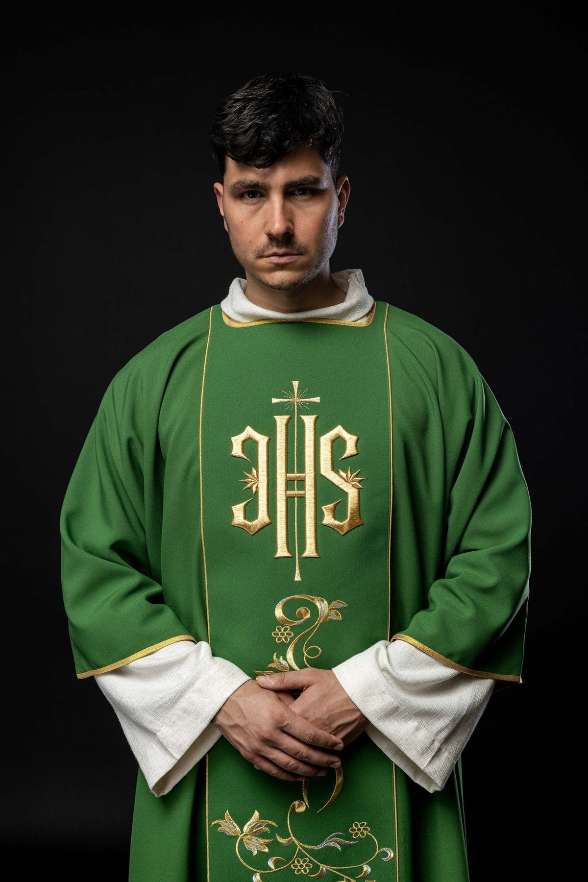 Green dalmatic front close-up with gold IHS embroidery and floral orphrey