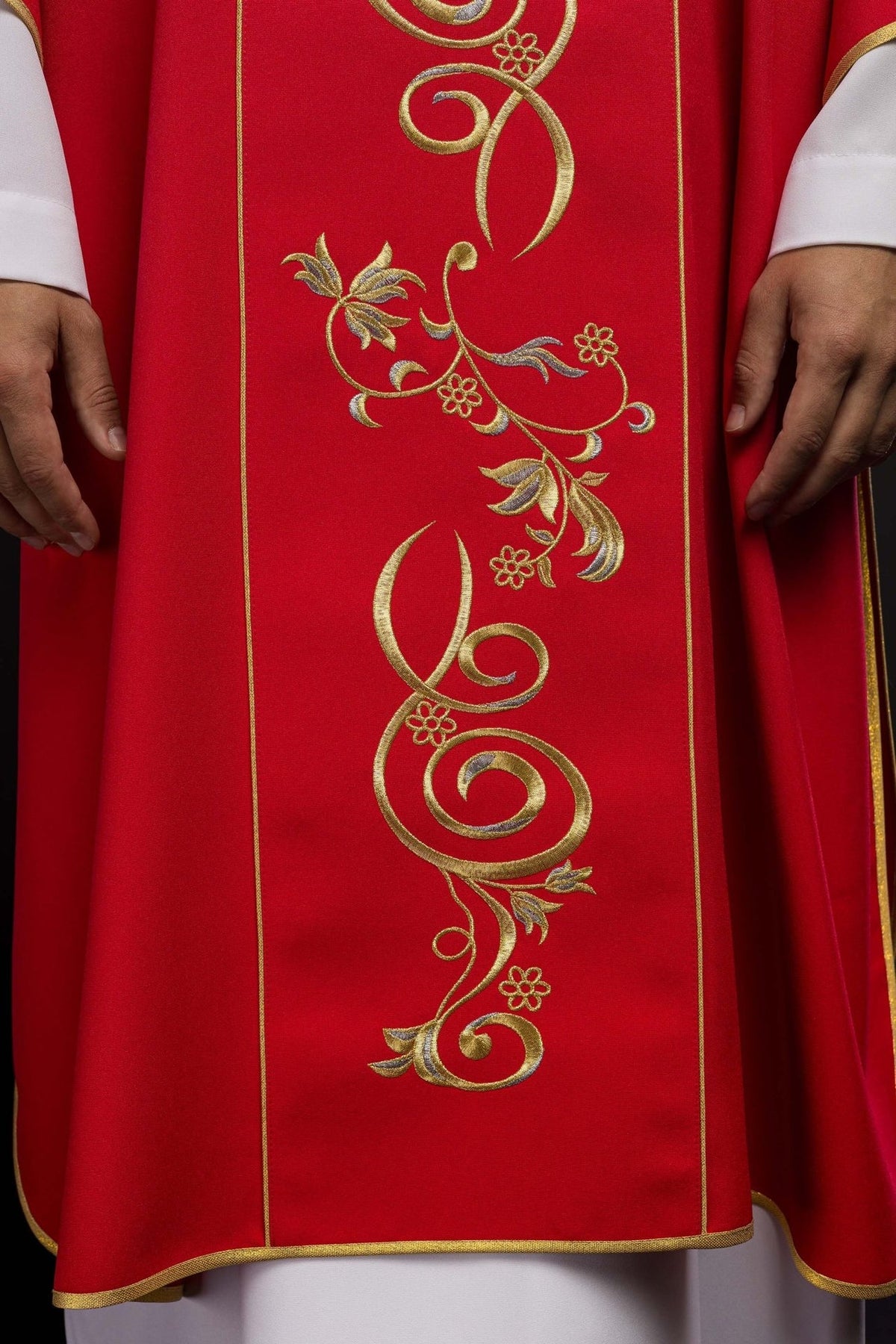 Red dalmatic close-up of gold floral embroidery on the orphrey