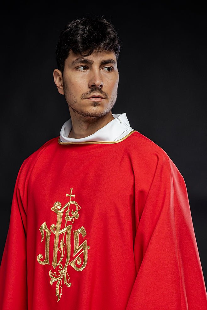 Red dalmatic, close front view of embroidered gold IHS design and trim