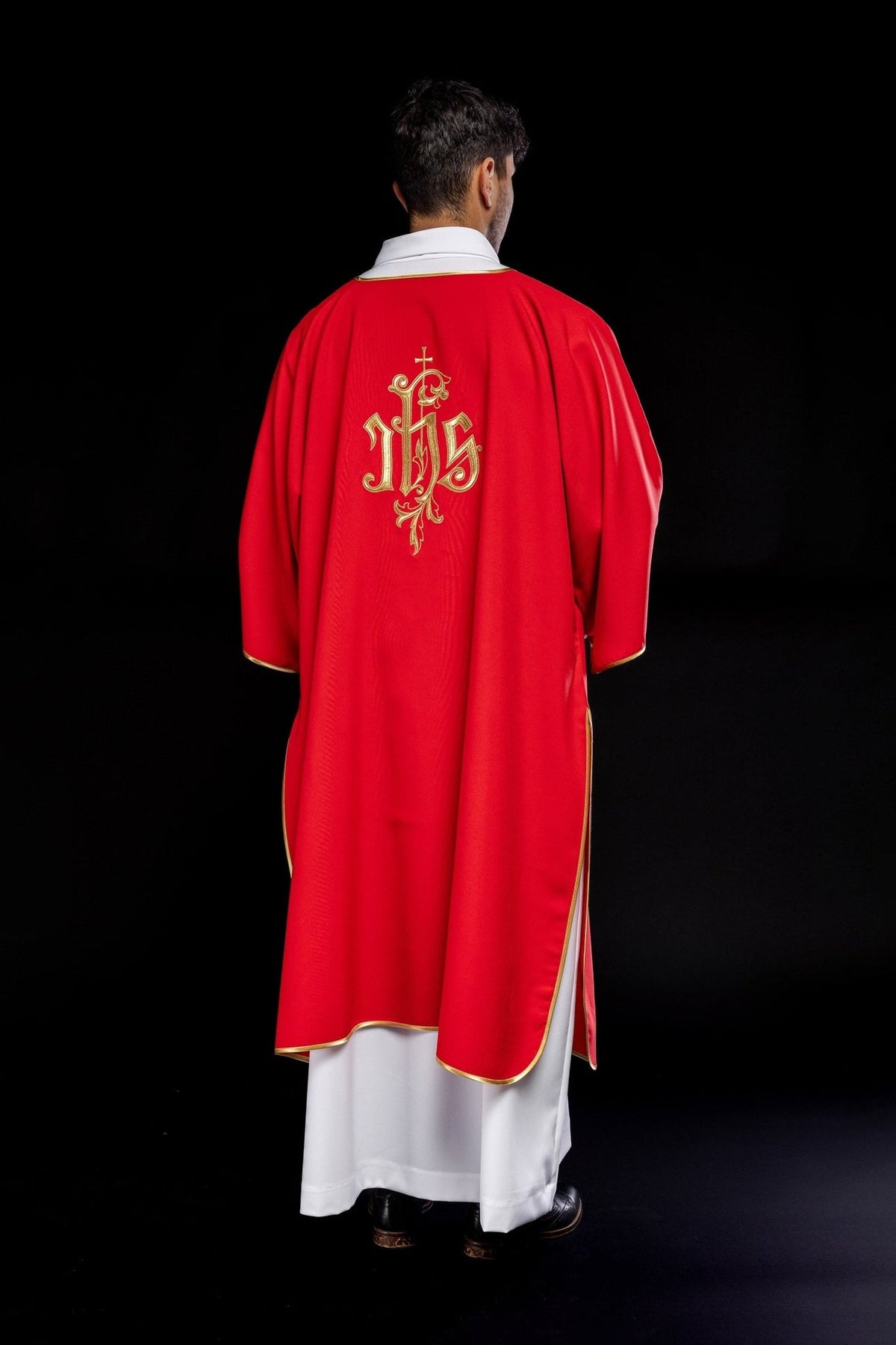 Red dalmatic, full back view with embroidered gold IHS design