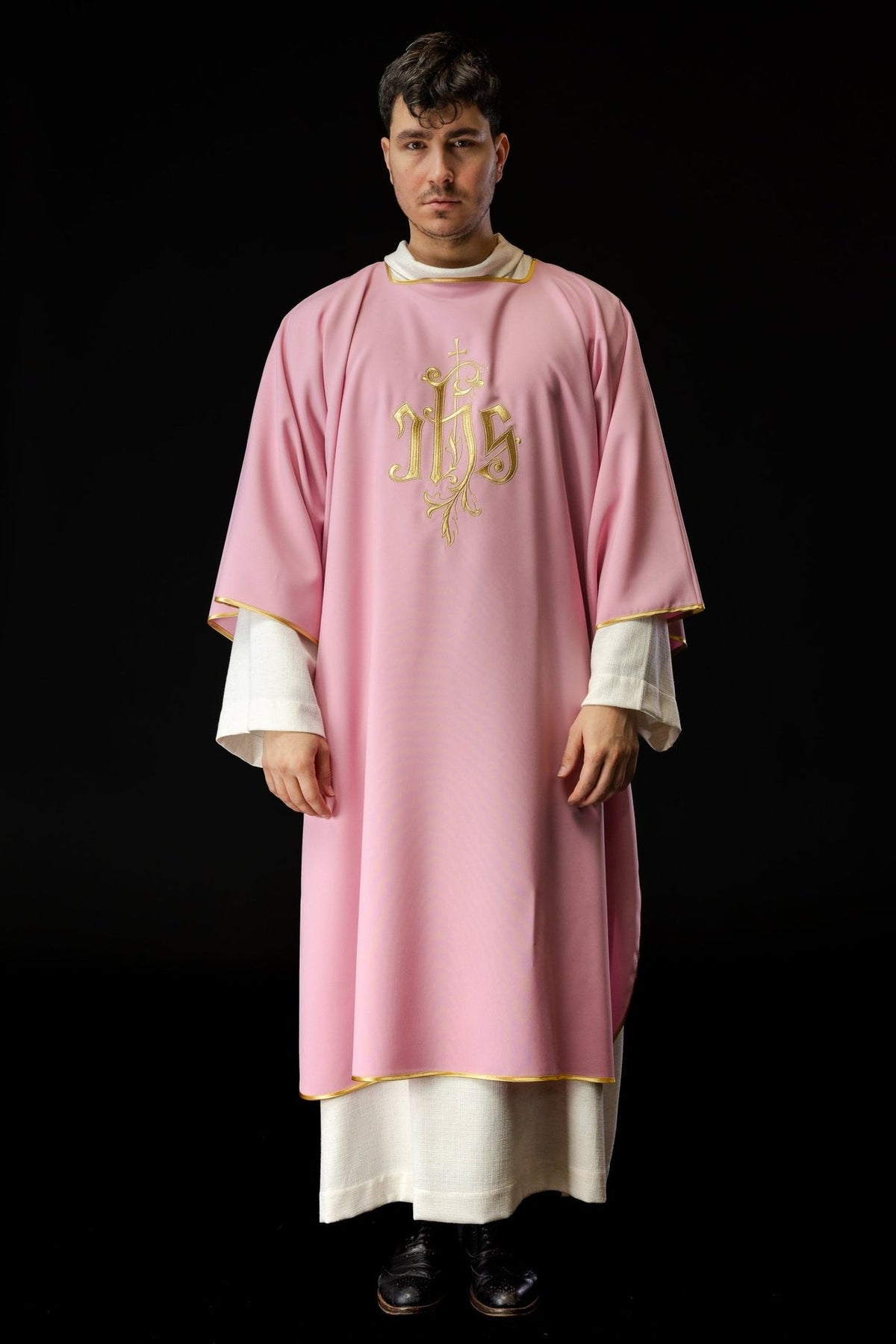 Rose dalmatic front view showing gold IHS embroidery and gold trim