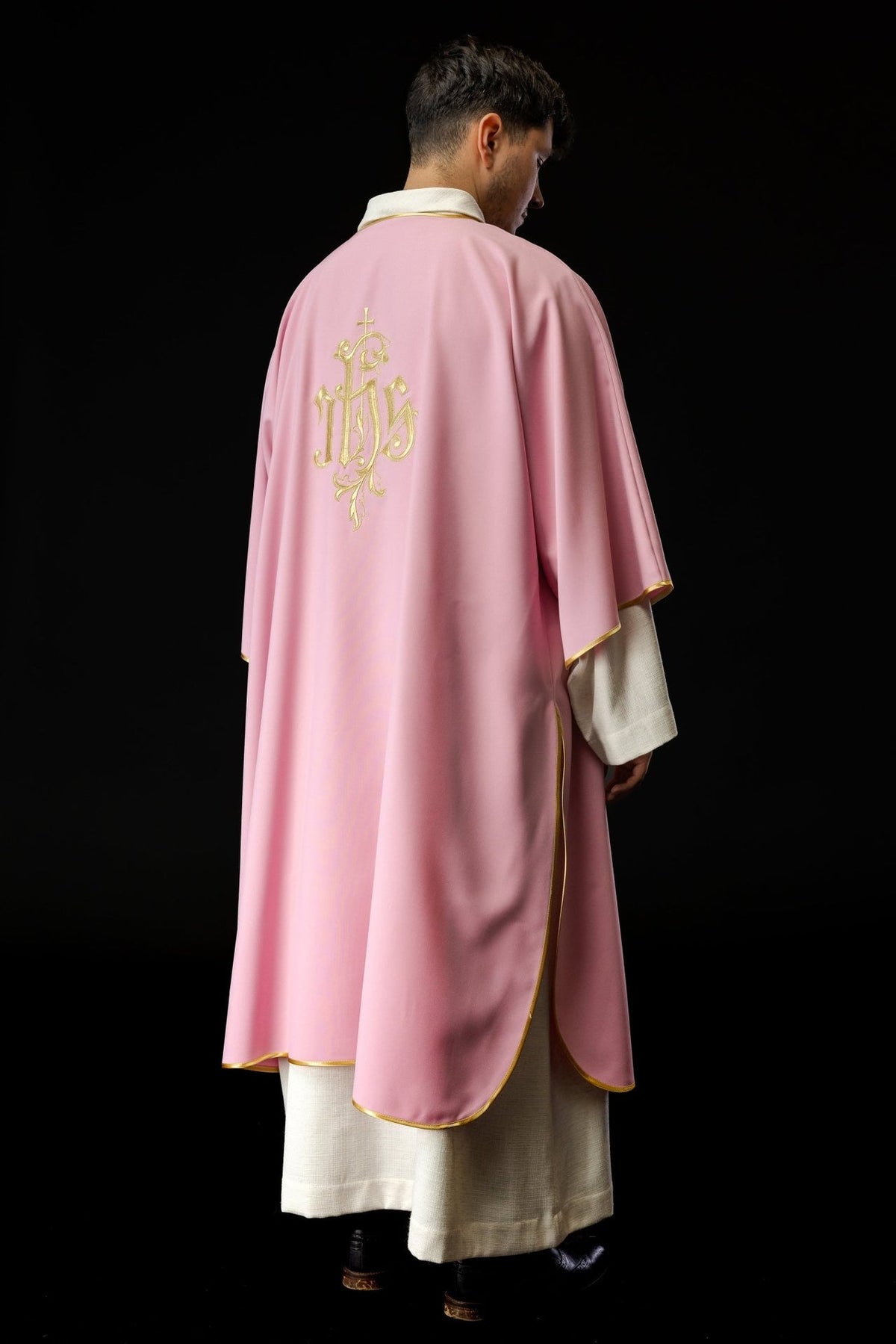 Rose dalmatic three-quarter back view with gold-trimmed edges