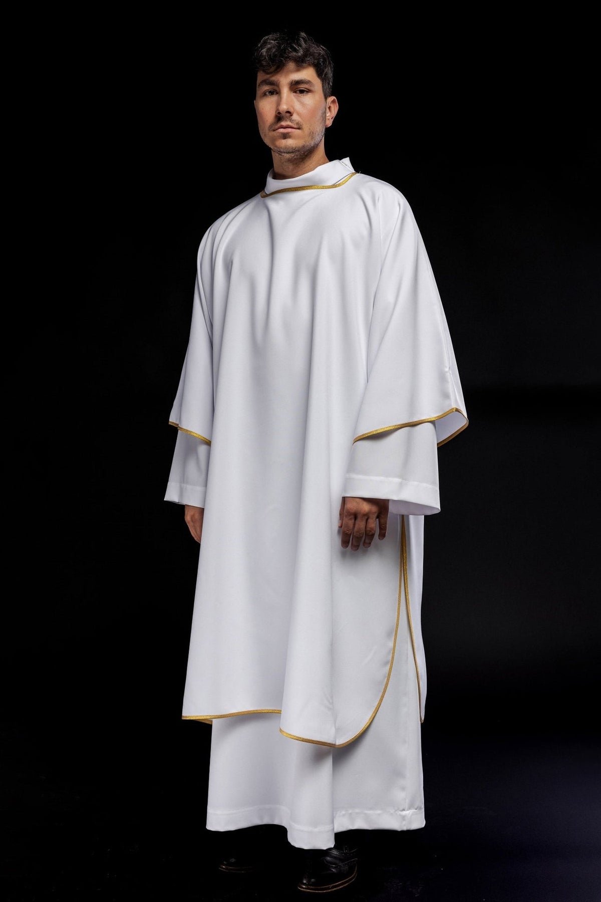 White dalmatic with gold trim, full front view showing smooth fabric and wide sleeves