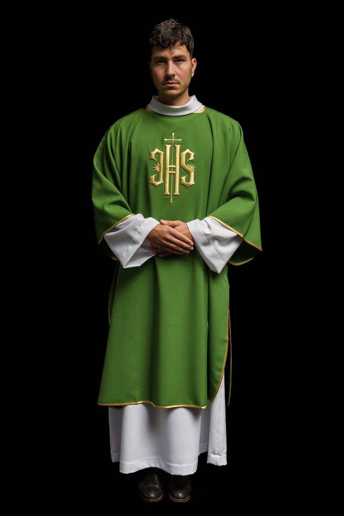 Green dalmatic worn full front view with gold IHS embroidery and gold trim