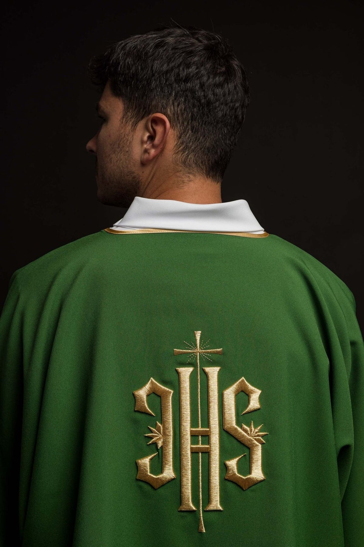 Green dalmatic back view with gold IHS embroidery and white collar