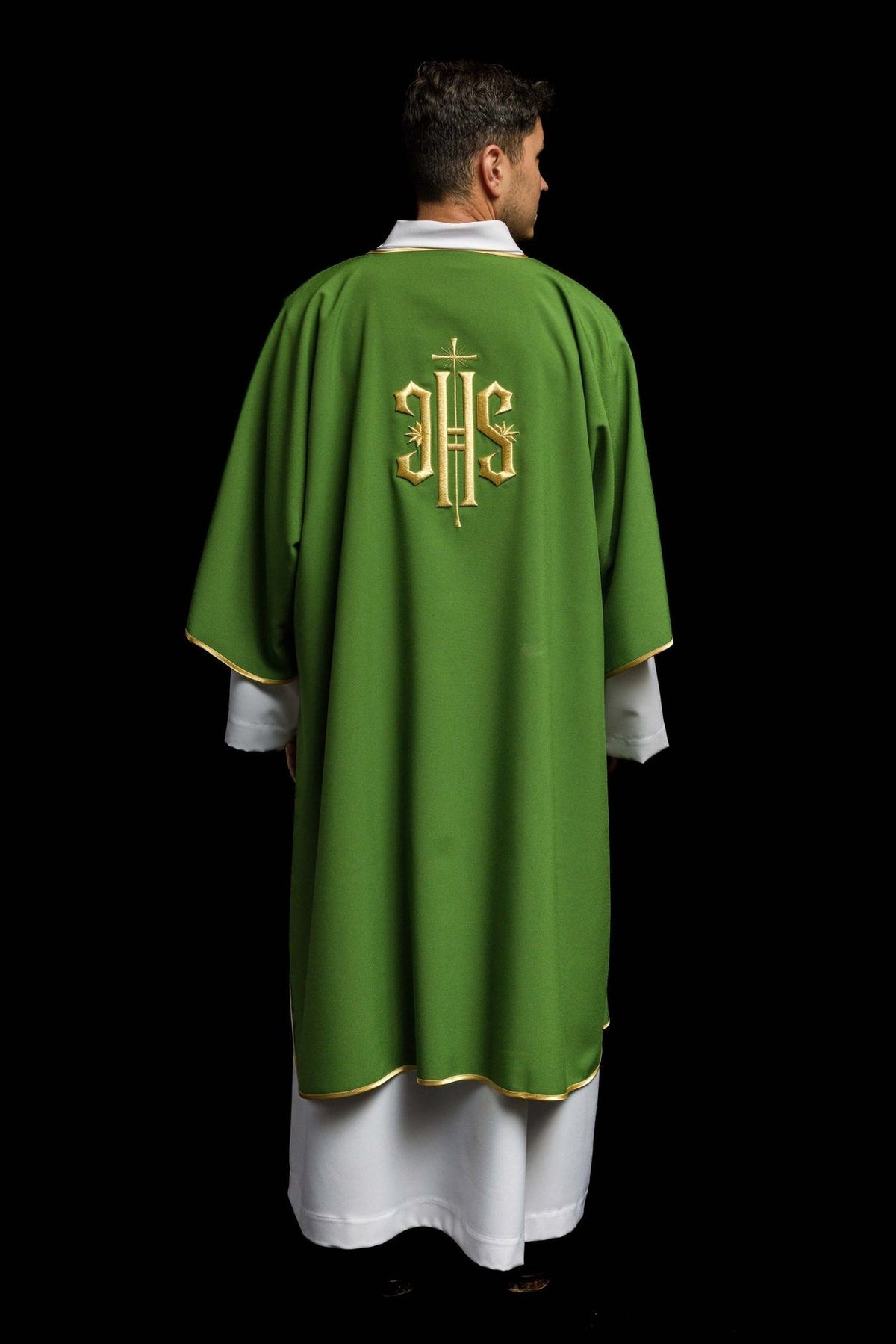 Green dalmatic worn back view with centered gold IHS embroidery