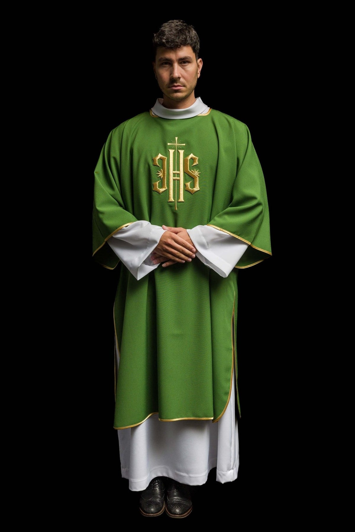 Green dalmatic worn front view showing gold embroidery, trim and white cuffs