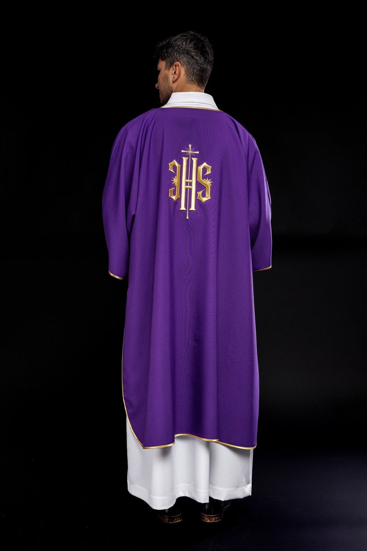 Purple dalmatic back view showing centered embroidered gold IHS