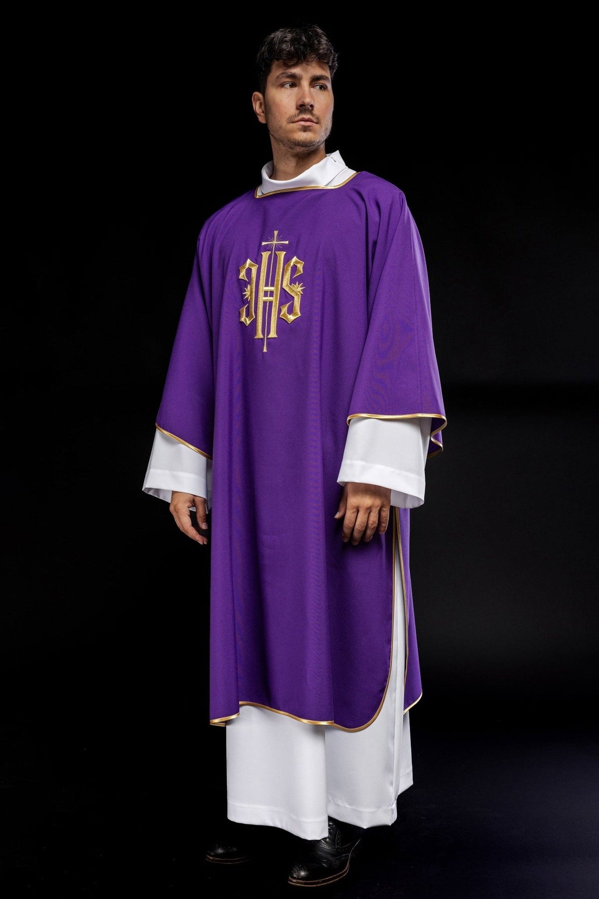 Purple dalmatic three-quarter front view with embroidered gold IHS and gold trim