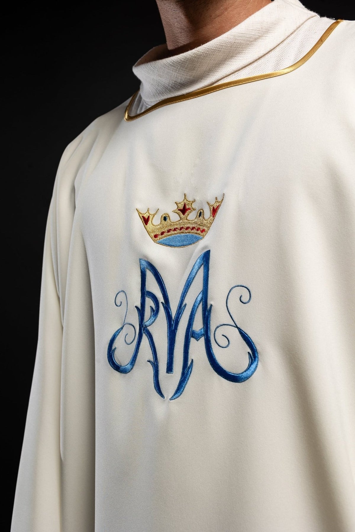 Dalmatic close-up of blue Marian embroidery and gold-trimmed neckline