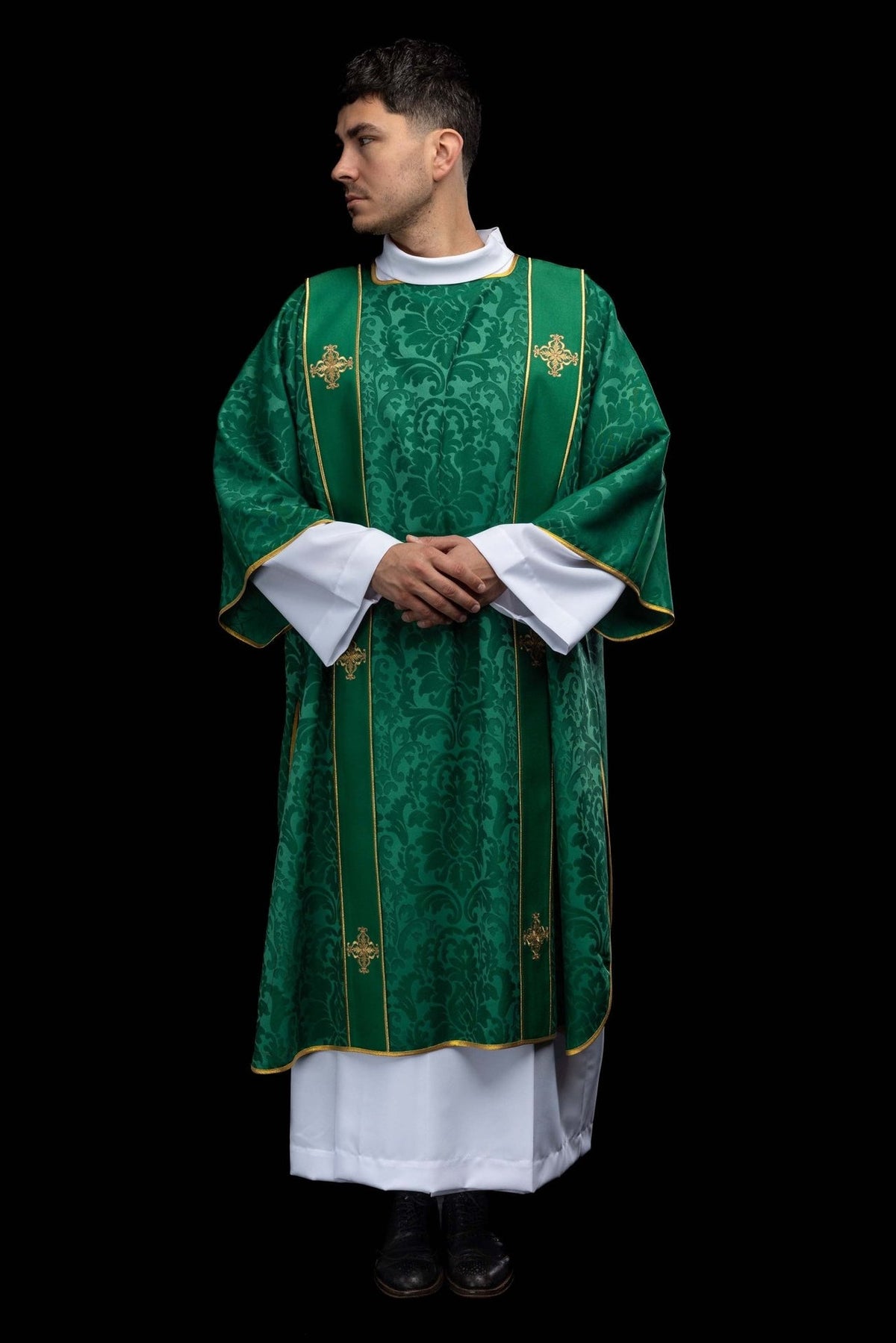 Green dalmatic front view with gold orphrey trim and embroidered crosses