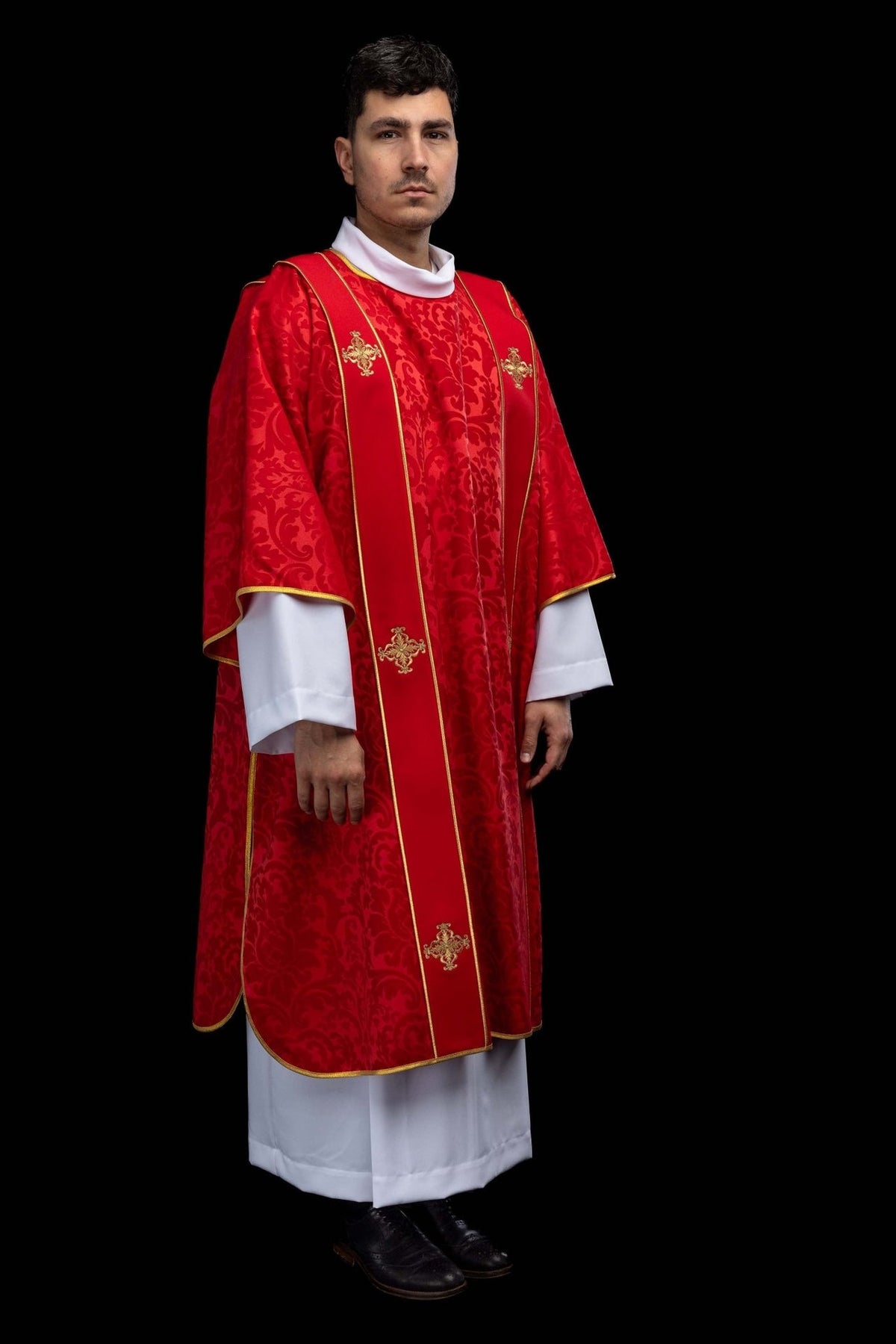 Red dalmatic three-quarter front view with embroidered gold crosses