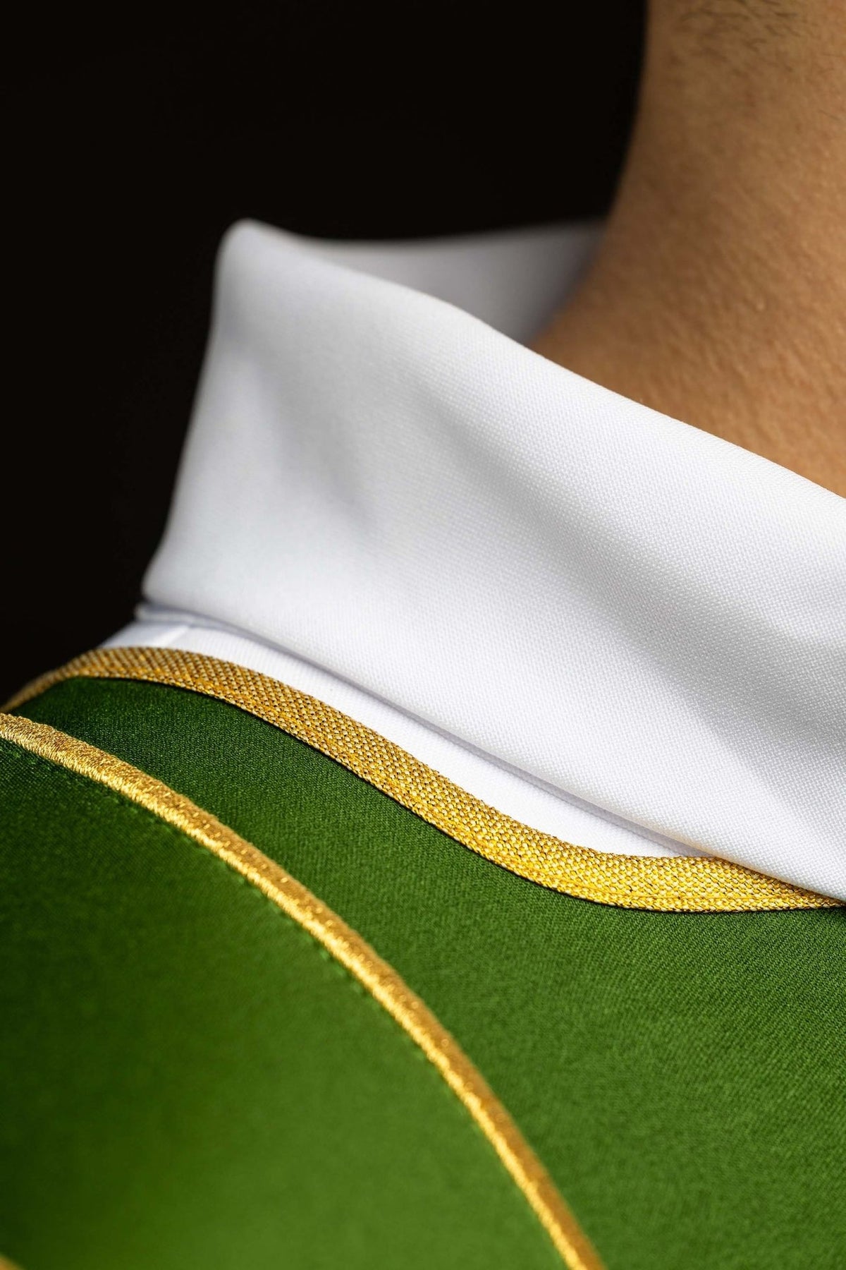 Green dalmatic neckline and gold trim close-up
