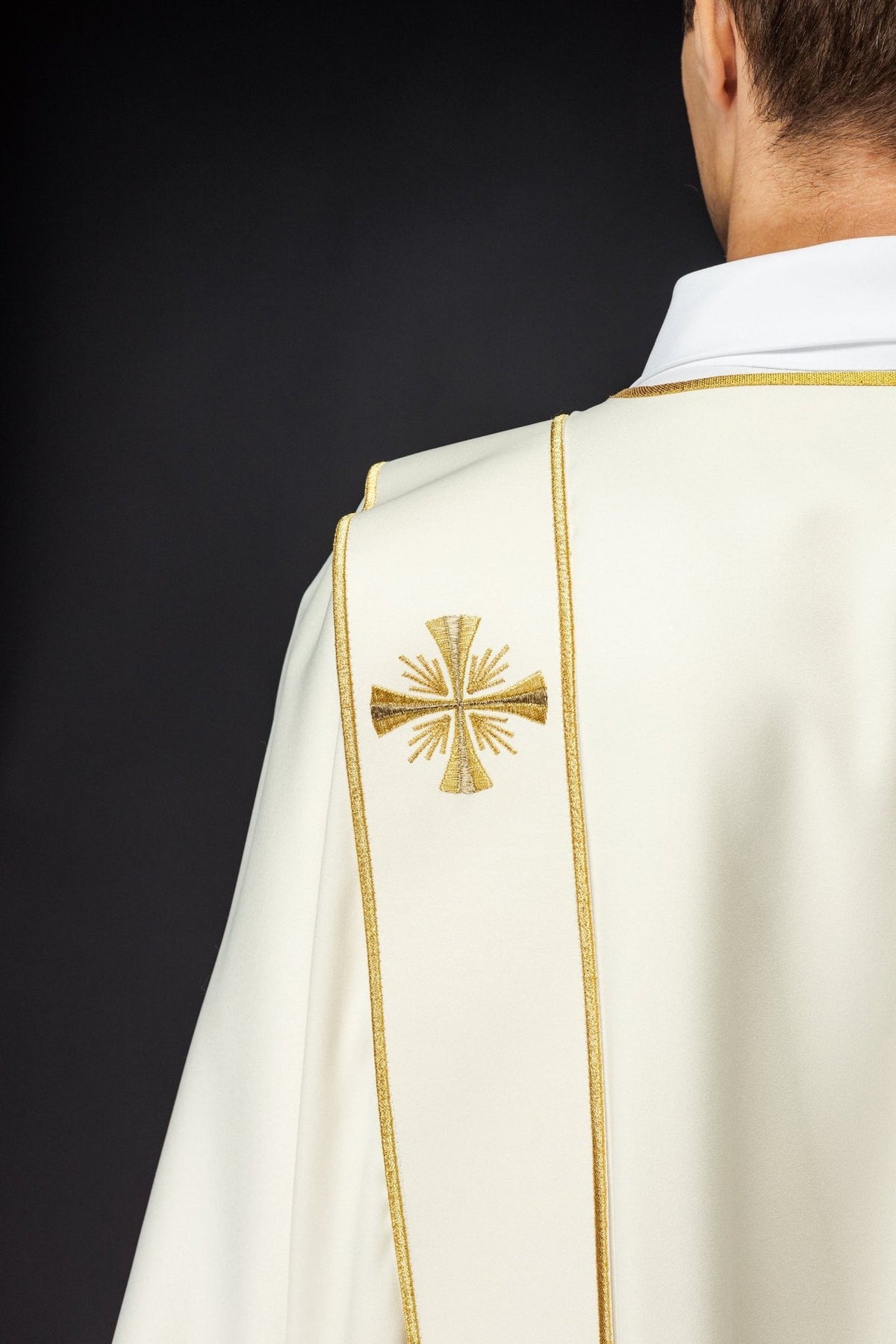 Ecru dalmatic back close-up with gold trim