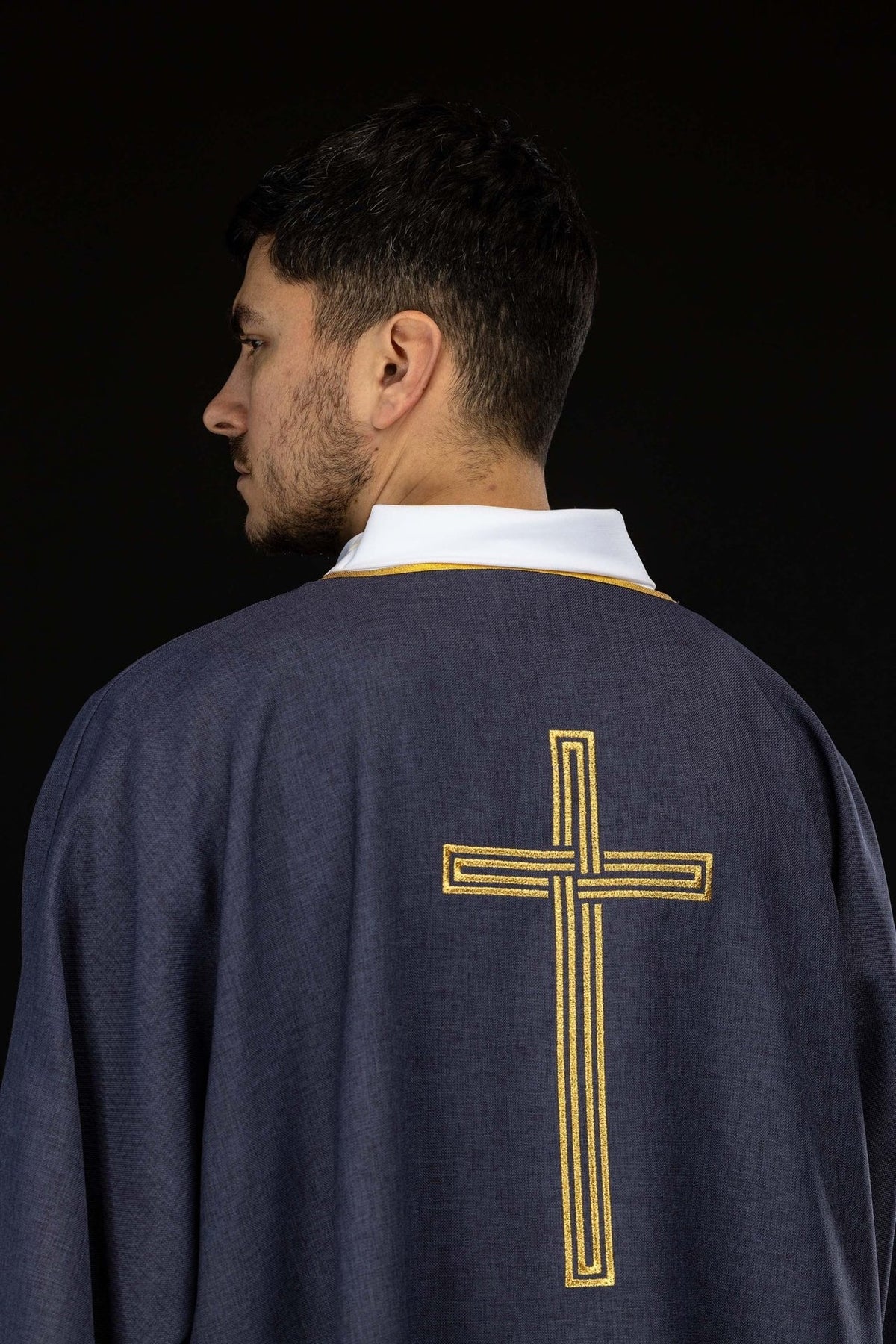 Purple dalmatic back close-up with embroidered gold cross