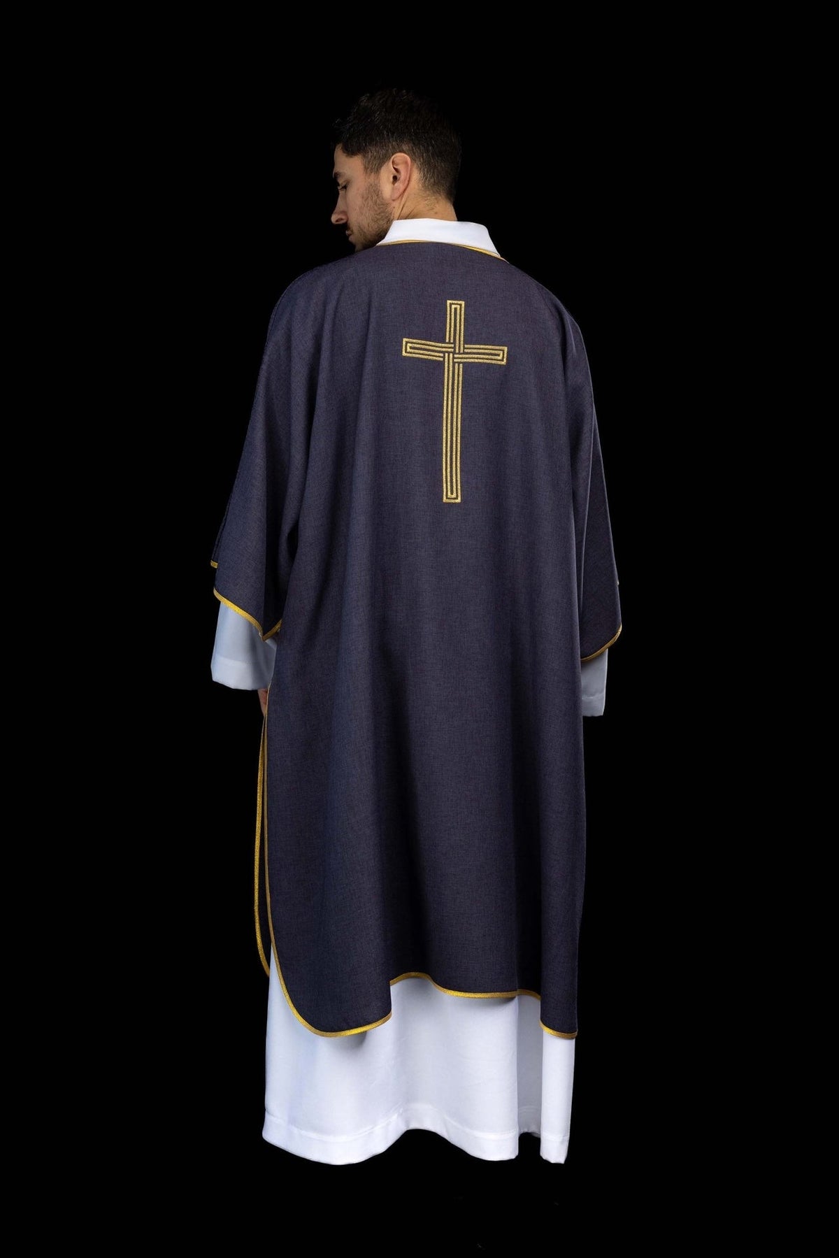 Purple dalmatic back view with gold trim and embroidered cross