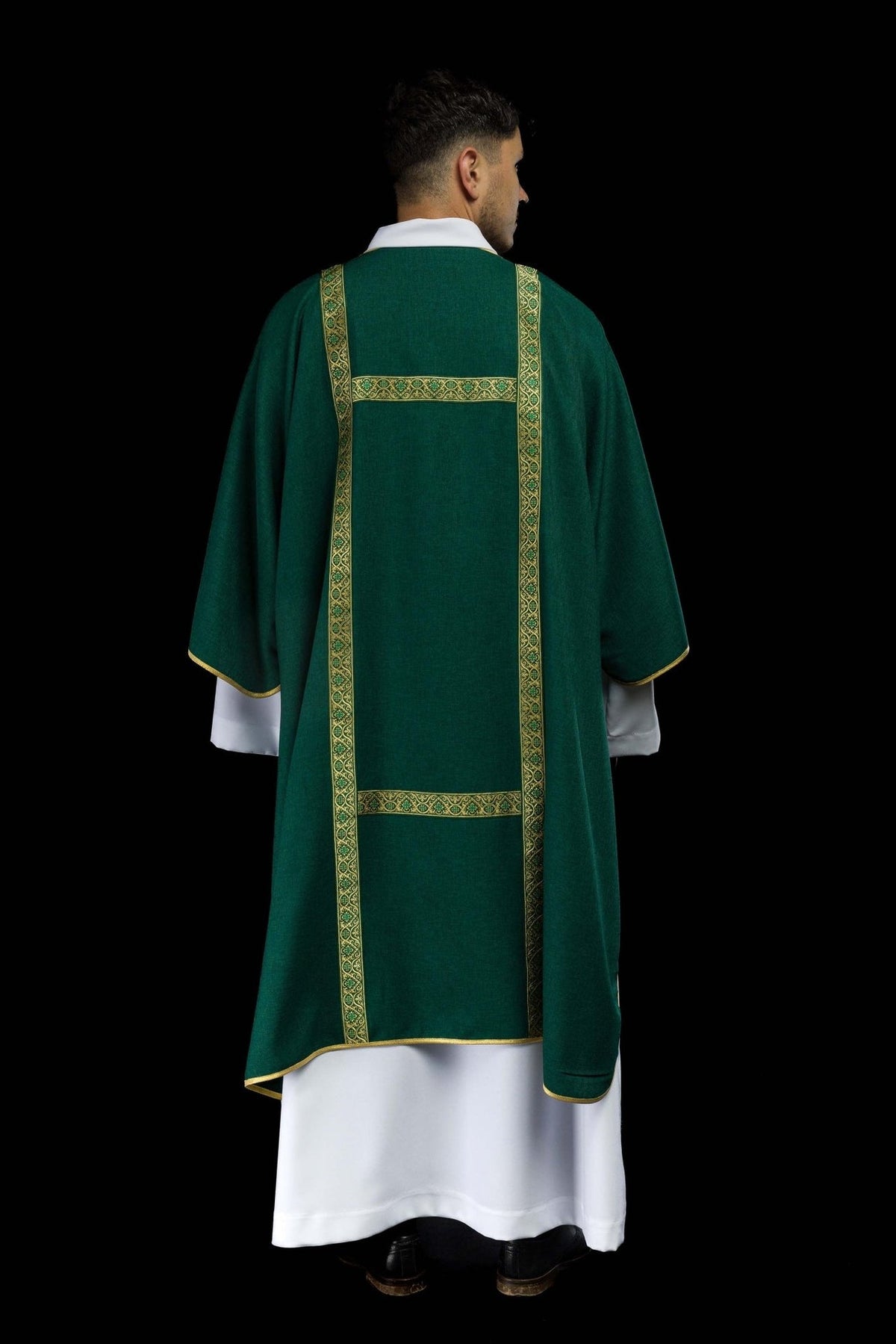 Green dalmatic worn back view with rectangular gold jacquard orphreys