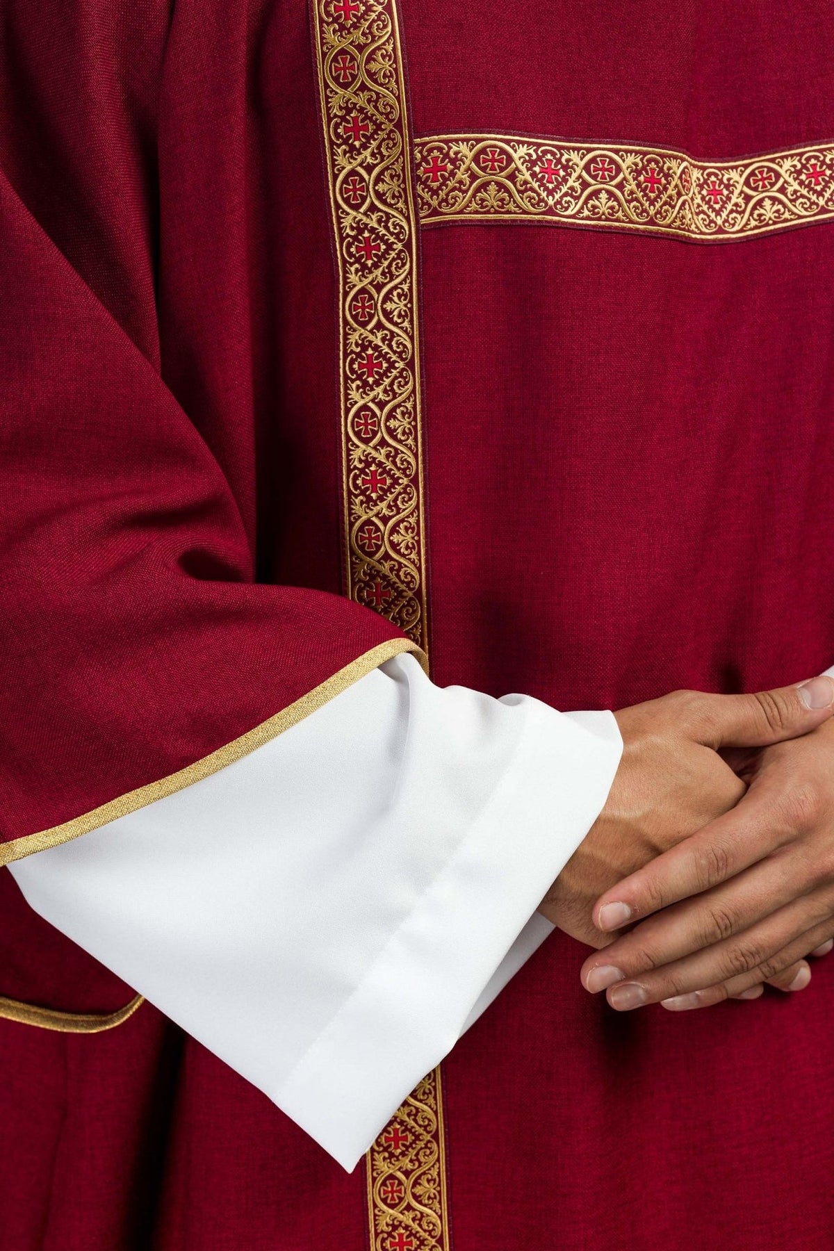 Red dalmatic detail showing intersecting gold orphreys