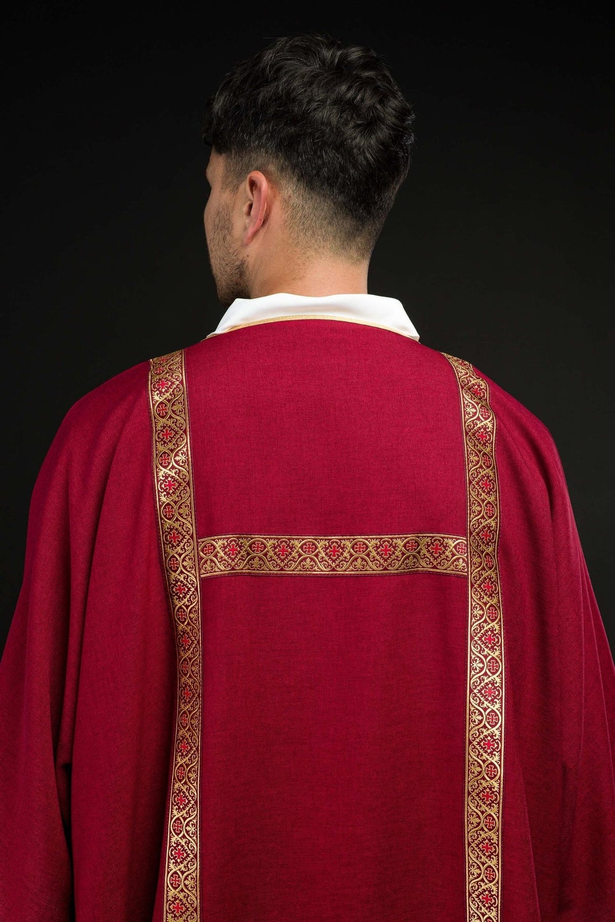 Red dalmatic back view with gold jacquard orphreys