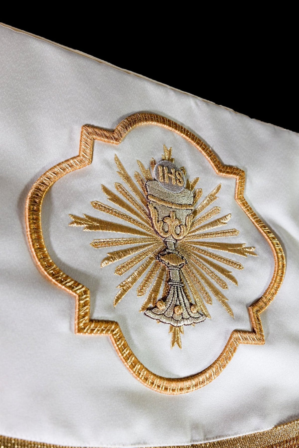 Canopy close-up with embroidered chalice and IHS medallion