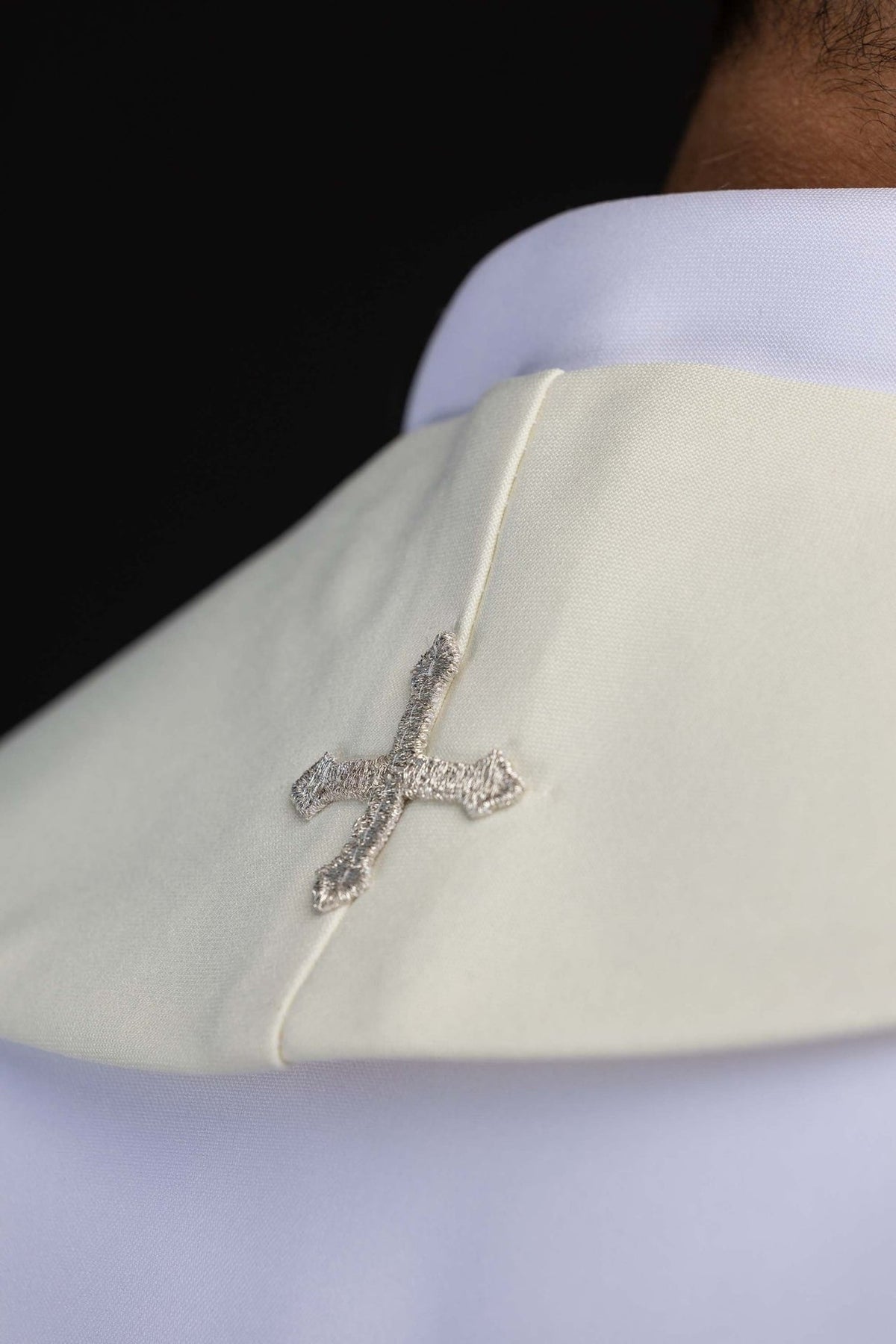 Marian stole side detail showing extended silver floral embroidery and rounded end
