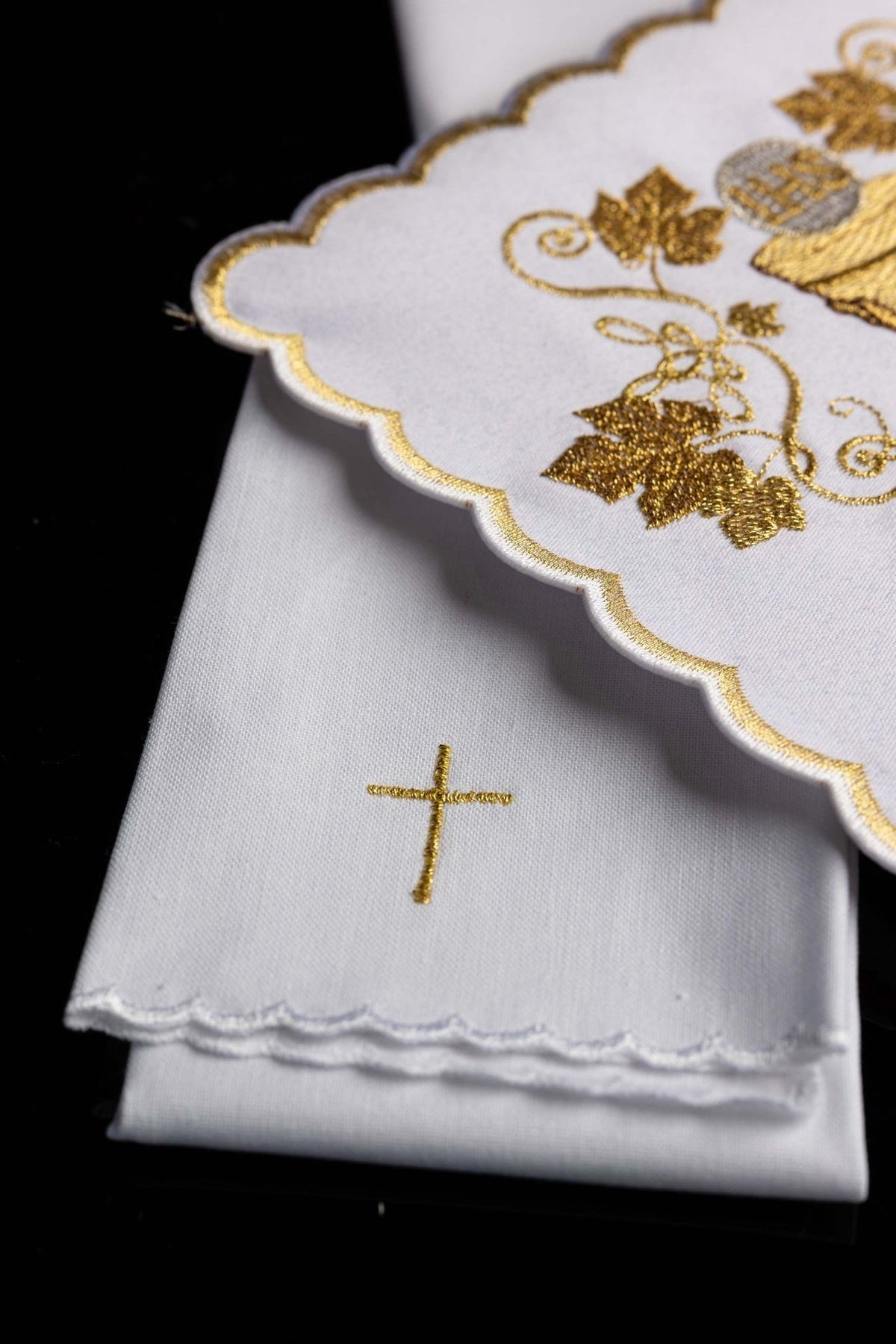 Altar linen set detail showing gold cross embroidery and layered scalloped edges