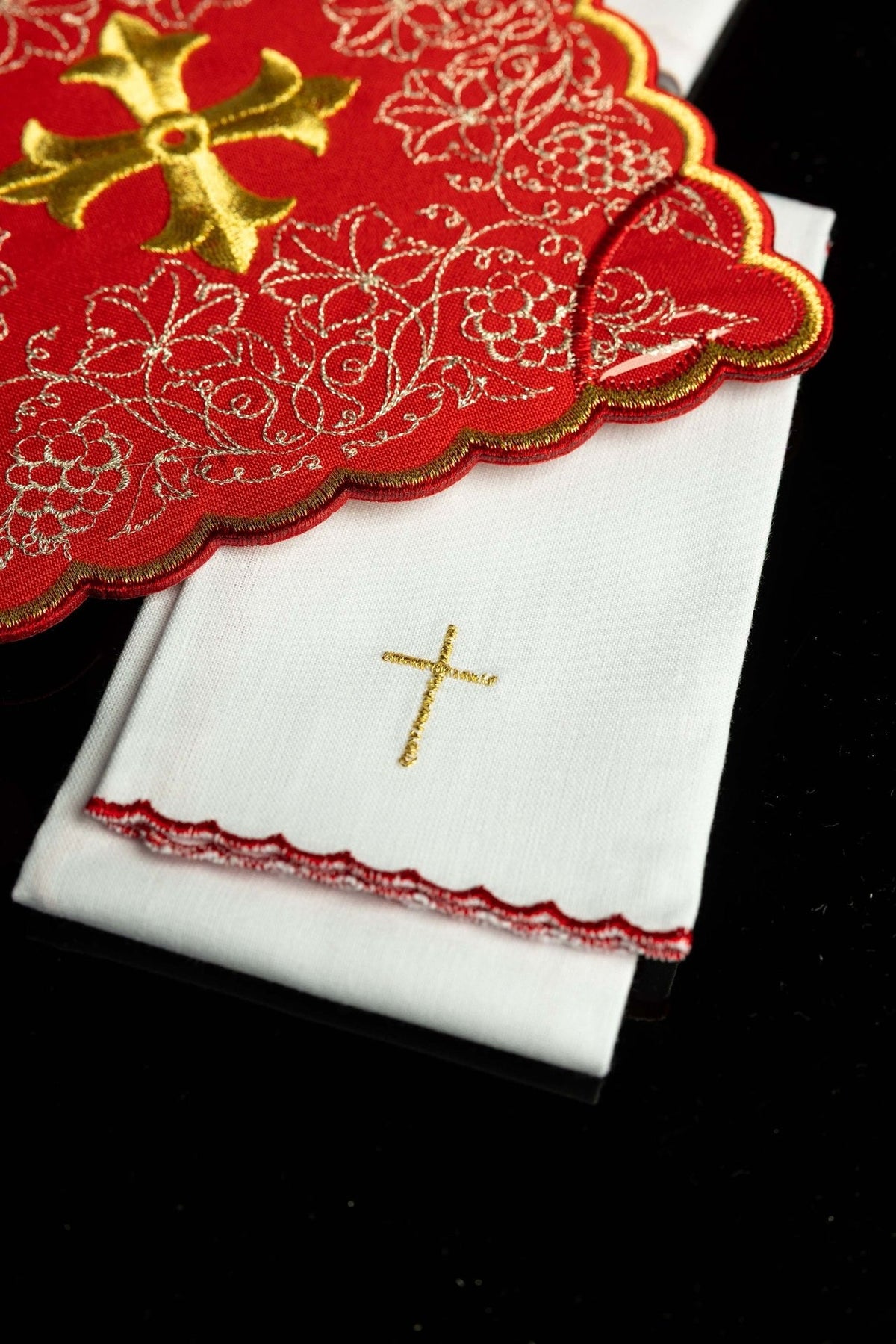 Altar linen set folded view with gold cross and red embroidered edging