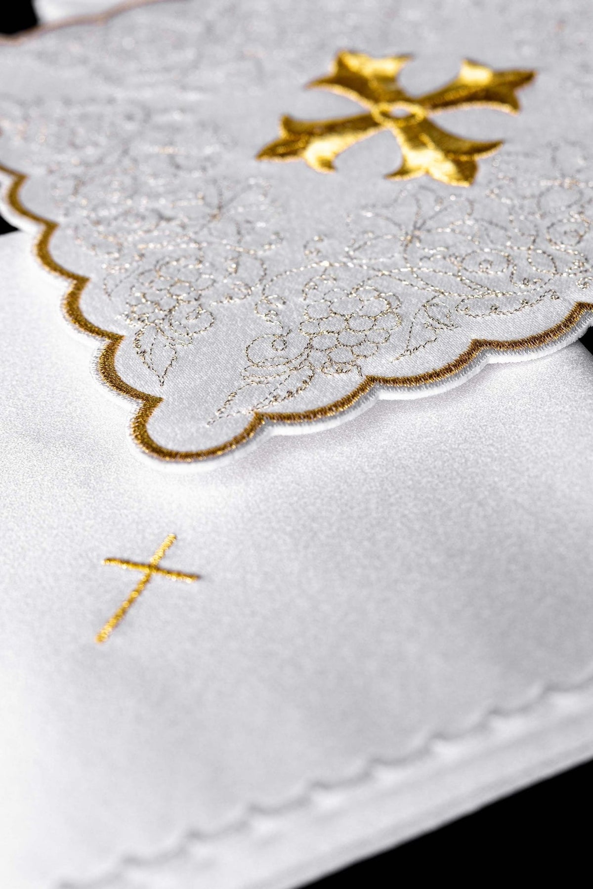 Altar linen set detail showing gold-edged scalloped border and floral embroidery