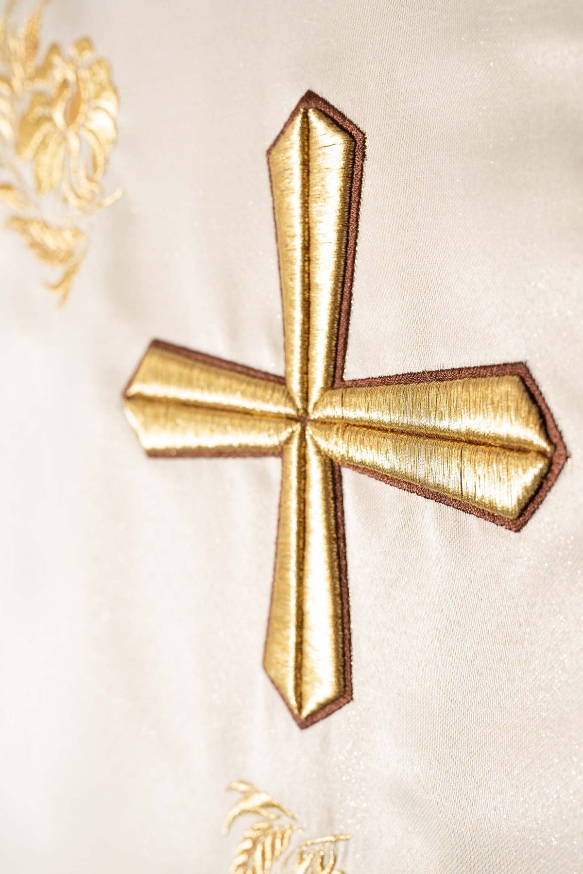 Embroidered cross chasuble, close-up of the gold cross embroidery