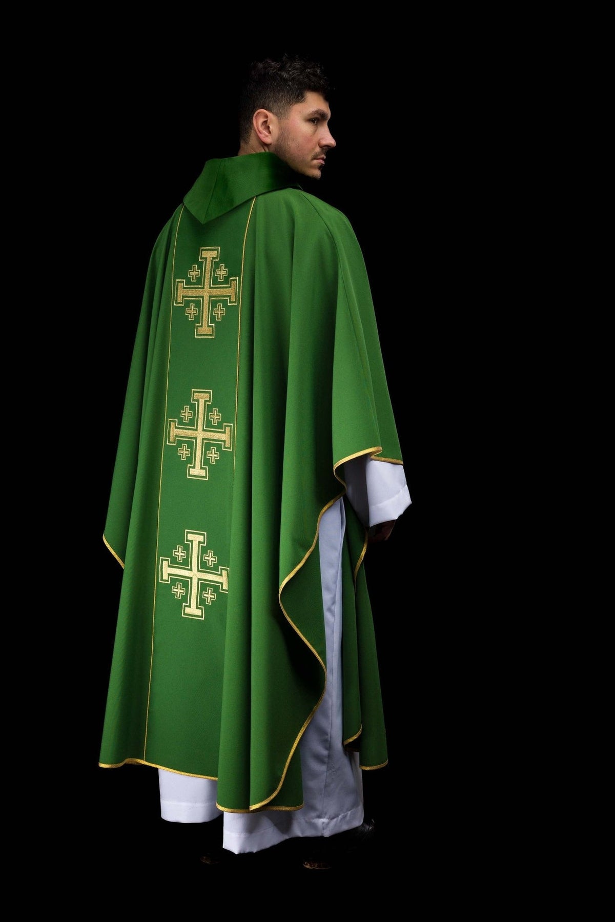 Green chasuble worn from the back with embroidered Jerusalem crosses on an orphrey