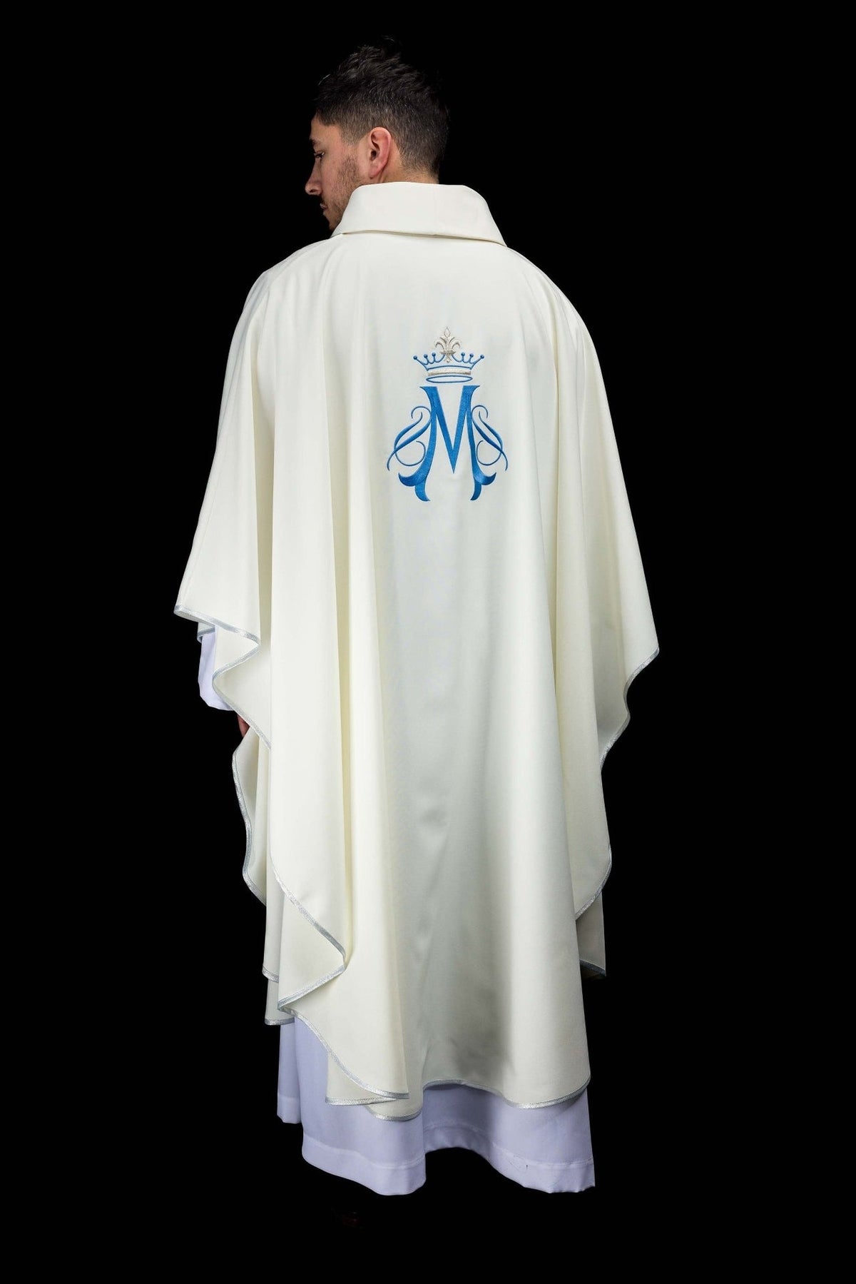 Marian chasuble back view with blue embroidered Marian motif and silver trim