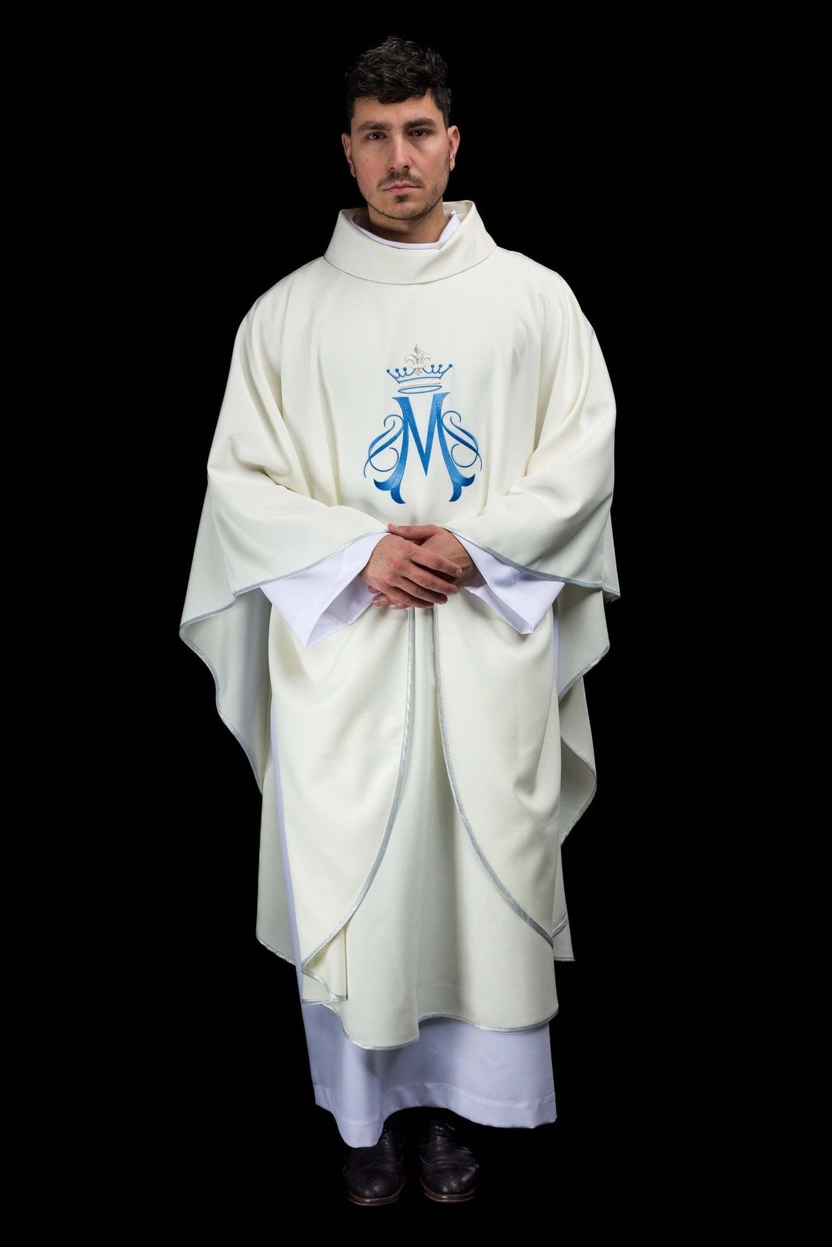 Marian chasuble front view showing ecru fabric, blue Marian motif and silver trim