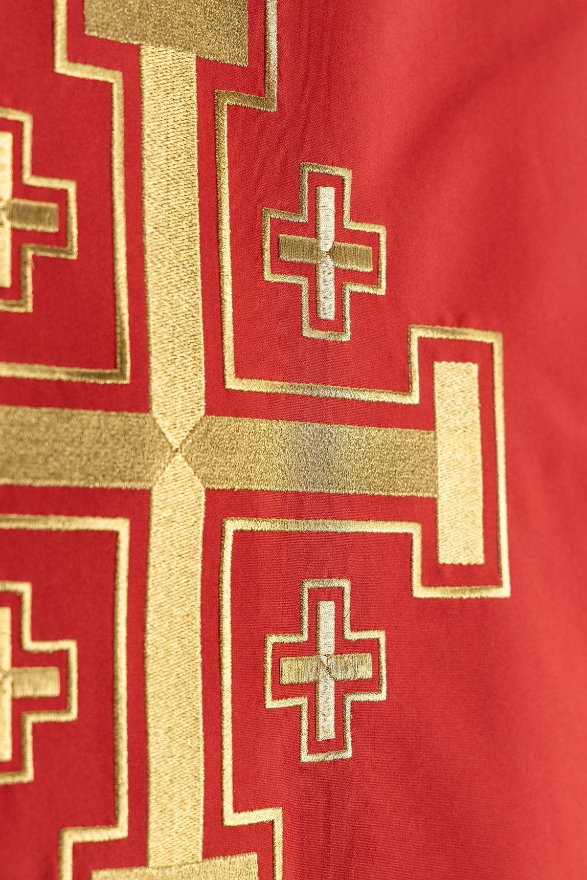 Church lectern cover close-up of gold Jerusalem cross embroidery and smaller crosses