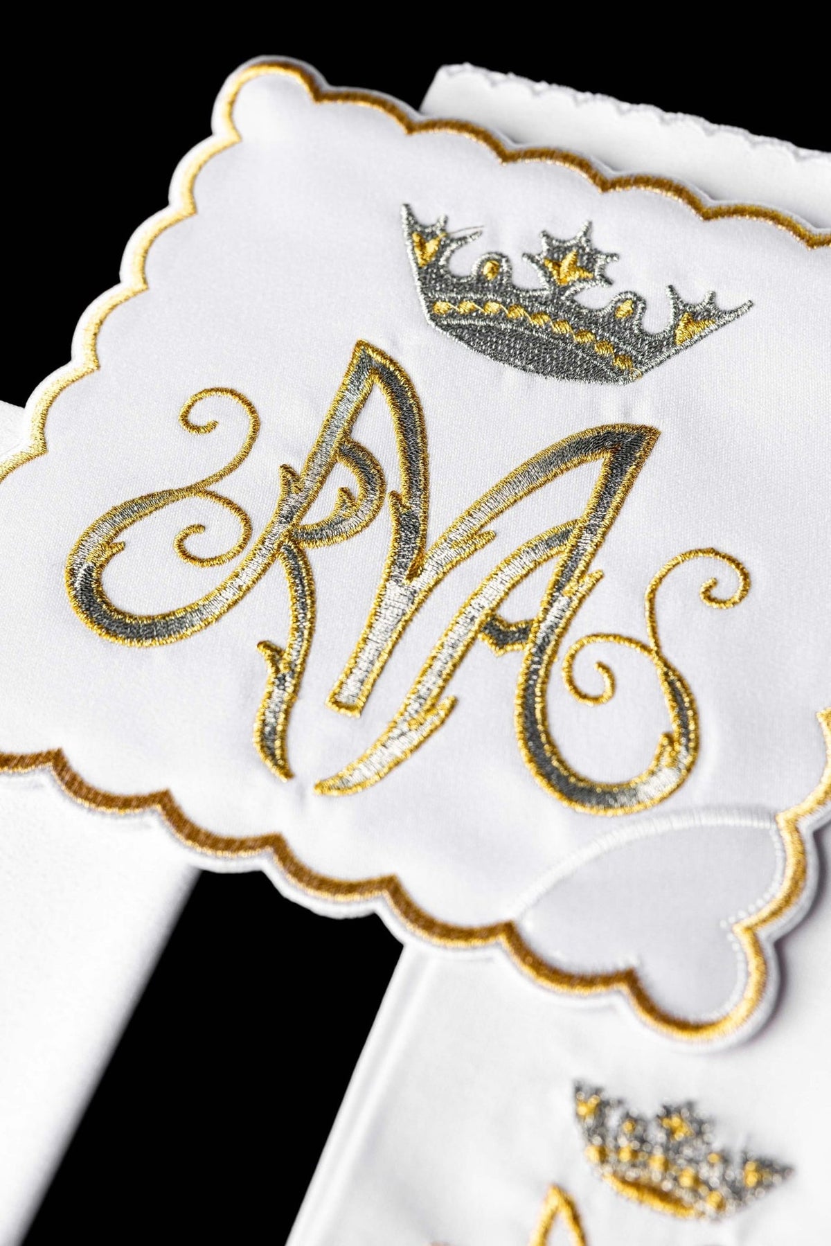 Altar linen set close-up showing silver and gold Marian embroidery and scalloped edging