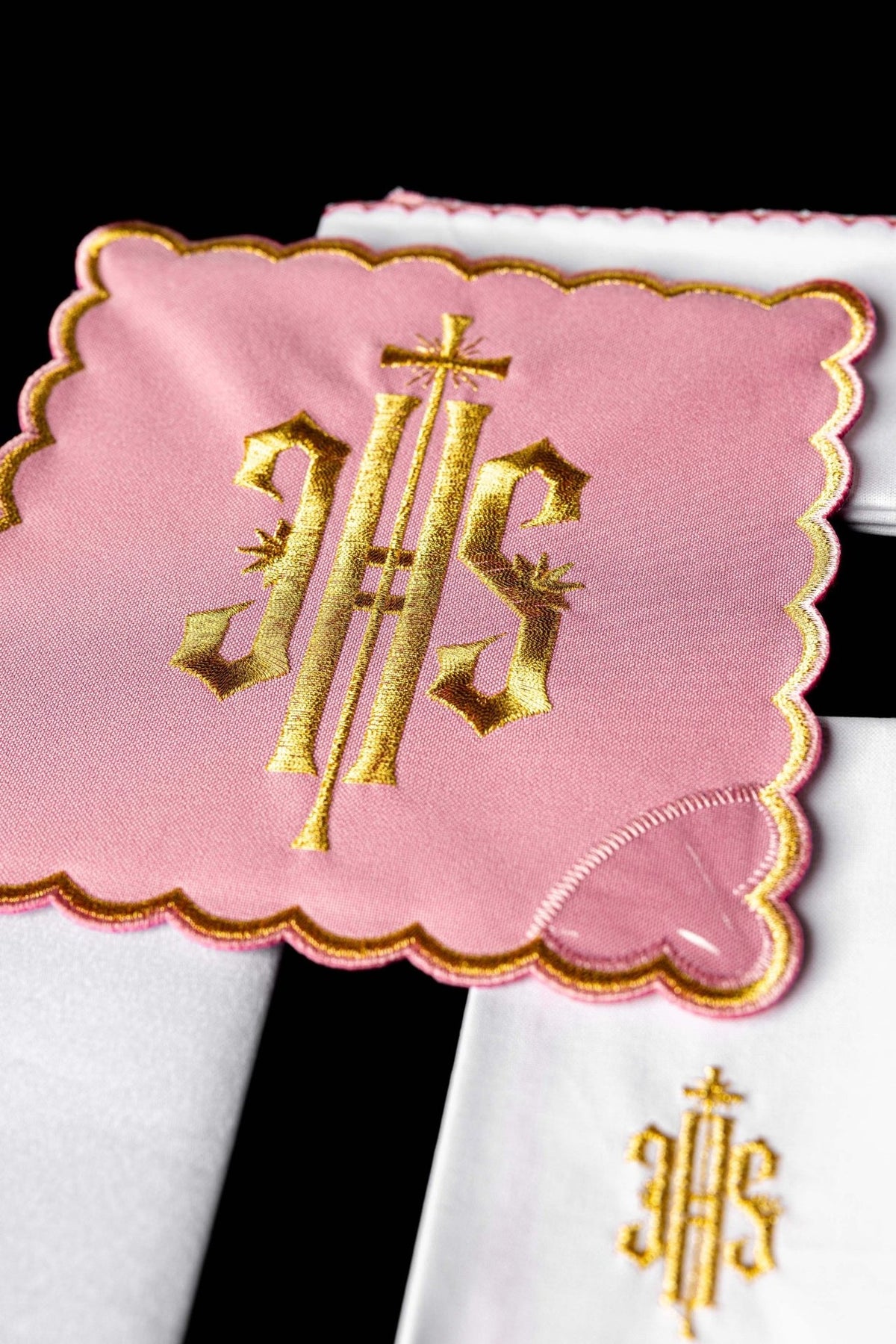 Rose altar linen set close-up showing gold embroidered IHS motif and scalloped trim