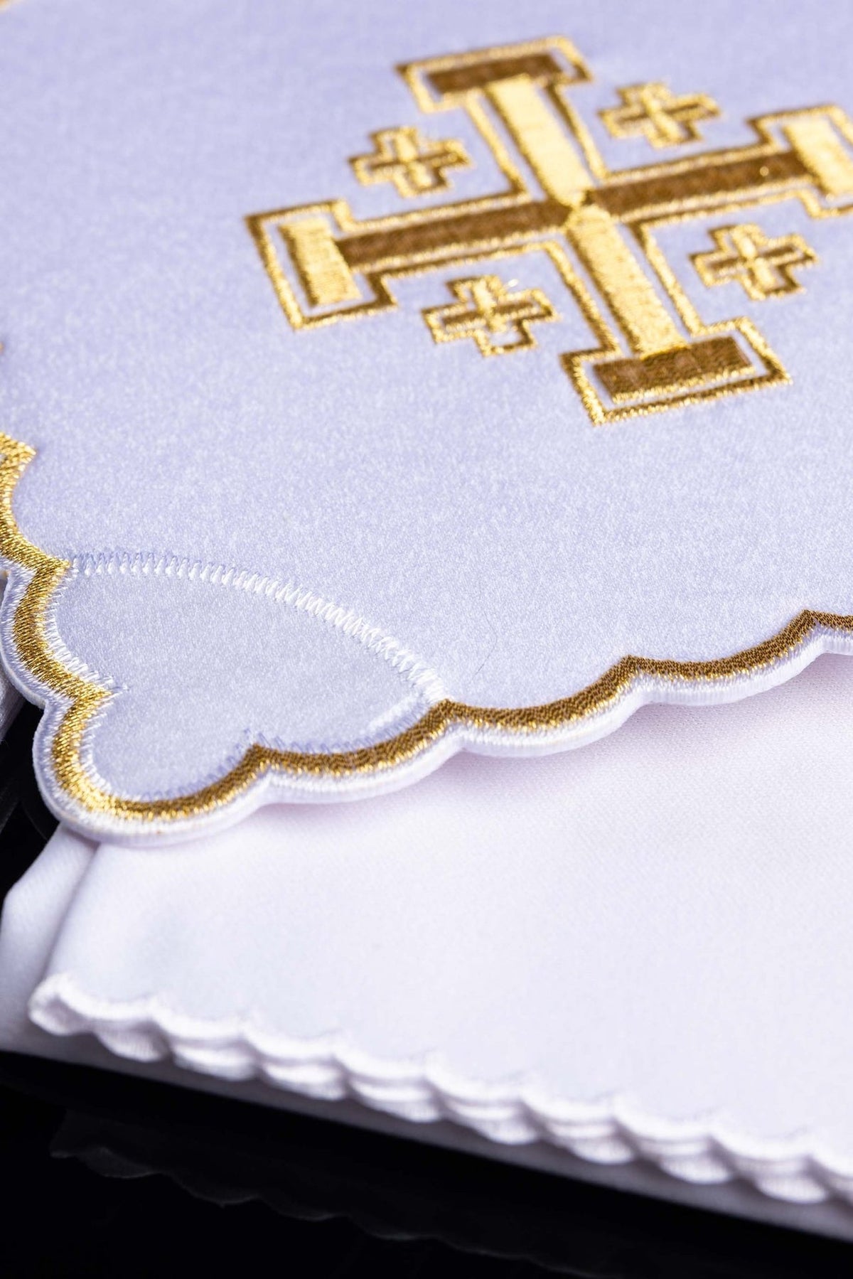 Altar linen set close-up showing gold cross embroidery and layered scalloped edging